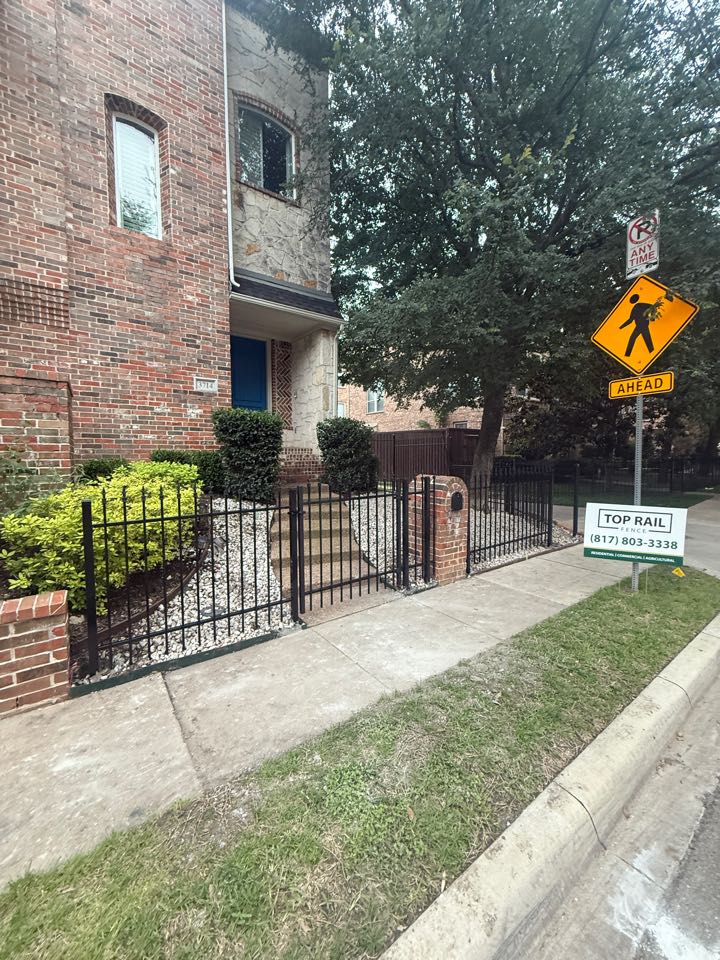 Dallas, TX - Top real fence Dallas just wrapped up a ornamental security fence for homeowner in Highland Park Dallas, Texas. We also installed perimeter barricades to ensure no more cars would drive up on her curb. This project was completed in one day and not only provides security to the front yard, but also adds an aesthetic finish with the finials.