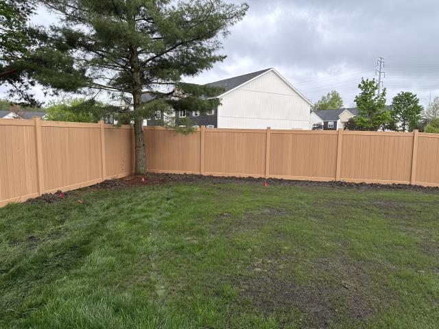 Lewis Center, OH - 240 feet of 6’ high cypress wood grain vinyl privacy fence installed. 