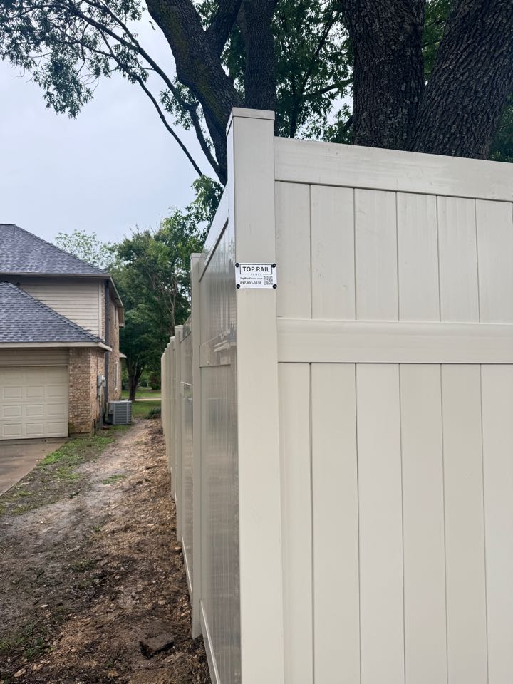 Dallas, TX - Top Rail Fence just completed an 8-foot tall tan vinyl privacy fence in Cedar Hill, TX. This low-maintenance, heat-resistant vinyl fence offers lasting durability and curb appeal—perfect for homeowners looking for security and style. Trusted fence company in Cedar Hill for professional vinyl fence installation done right.