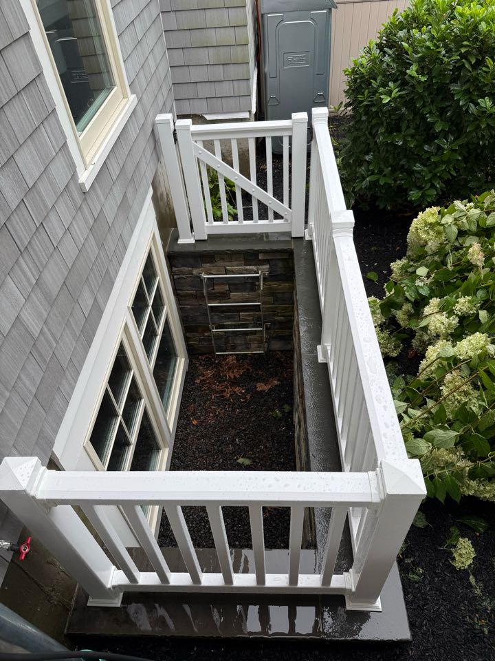 Dix Hills, NY - Installed a 3 ft PVC railing around an egress window in Dix Hills, NY today! Strong, safe, and low-maintenance – perfect for lasting curb appeal. Call Top Rail Fence Huntington for expert fence and railing installations across Huntington, Smithtown, and Dix Hills.  #FenceCompany #PVCFence #RailingInstallation #DixHillsNY #TopRailFenceHuntington #VeteranOwned 