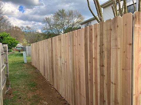 Lookout Mountain, TN - Top Rail Fence Chattanooga recently installed a premium red cedar stockade-style privacy fence for a homeowner in Lookout Mountain, TN. Built for both function and beauty, this fence provides full backyard privacy while enhancing the property's natural mountain charm.  We used high-quality Western Red Cedar, known for its natural resistance to rot, insects, and warping—making it one of the best choices for long-term durability in the Southeast. The stockade style uses tightly spaced vertical boards with no gaps, delivering a solid barrier ideal for privacy, pet containment, and reducing outside noise.  The homeowner chose a natural wood finish to blend seamlessly with the wooded landscape of Lookout Mountain. Over time, the cedar will age to a beautiful silver-gray, offering a timeless, low-maintenance option that requires no paint or stain unless desired.
