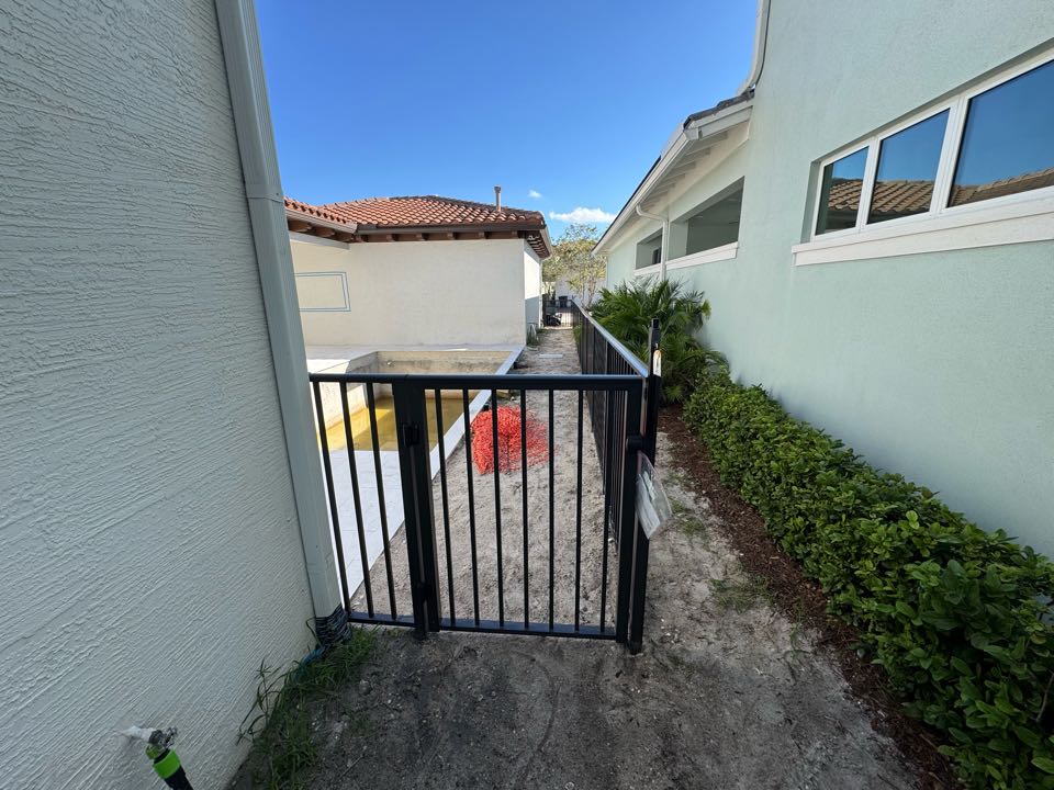 In the Alton community of Palm Beach Gardens, we installed a 4ft tall bronze aluminum fence with two pool code compliant gates for a customer’s new pool. Our team handled the entire permit process to make things seamless from start to finish. The end result is a clean, durable, and HOA-approved fence that adds both safety and style to the backyard.