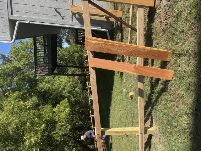 Kansas City, MO - Top Rail Fence installed a four-foot privacy fence to keep the new dogs in the yard. 