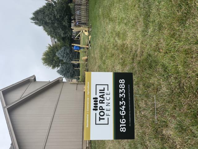 Kansas City, MO - Top Rail Fence completed a four-foot dog-eared cedar picket fence with French Gothic posts.  