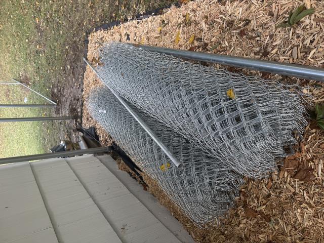 Kansas City, MO - Top Rail Fence installed a six-foot galvanized chain-link fence for a customer whose dog used to be an escape artist.  