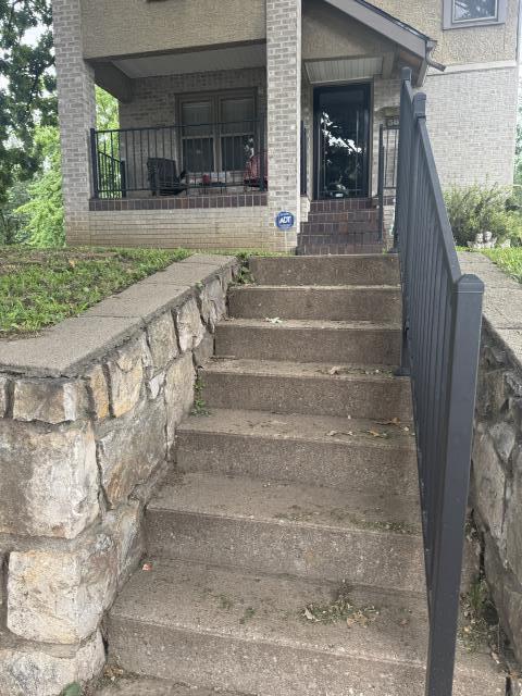 Kansas City, MO - Top Rail Fence was asked to add a railing to this porch and staircase. 