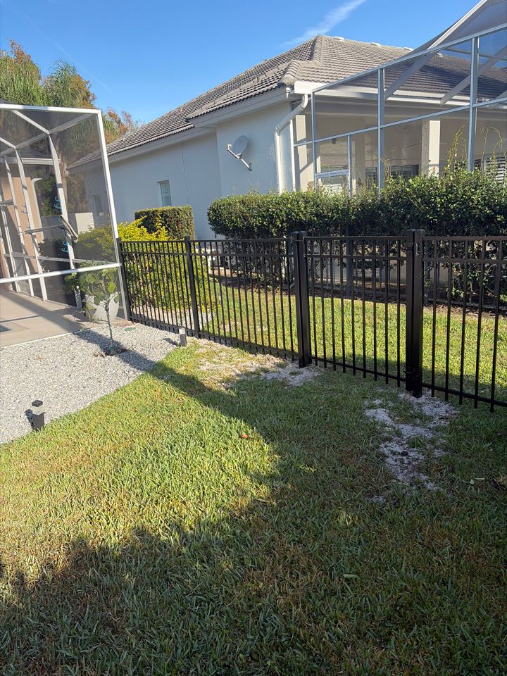 Lutz, FL - We’re installing this sleek black aluminum fence in the backyard for this family in Cheval