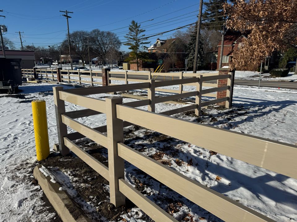 Royal Oak, MI - Our team installed 155 feet of 4 foot tall clay colored vinyl ranch rail fence in order to create a modern and aesthetically pleasing barrier for the customer at their Royal Oak business.