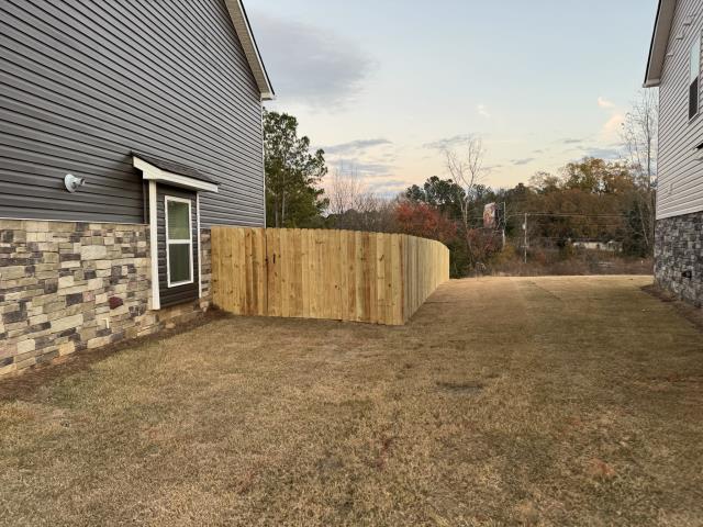 Chattanooga, TN - 6-Foot Wood Privacy Fence Installation in Chattanooga, TN  Top Rail Fence Chattanooga recently completed a 6-foot wood privacy fence for a homeowner in Chattanooga, TN, designed to provide full backyard privacy, security, and a clean, natural look that complements the property. Built with high-quality pressure-treated lumber and sturdy construction, this fence offers long-lasting durability and strong protection for pets, kids, and outdoor living spaces.  This classic wood privacy style remains one of the most popular fencing solutions in the Chattanooga area thanks to its affordability, versatility, and ability to blend seamlessly into any landscape. The finished result is a solid, beautiful fence that enhances both curb appeal and functionality.  For homeowners looking for professional wood privacy fence installation in Chattanooga, Top Rail Fence Chattanooga continues to deliver dependable craftsmanship, great customer service, and fences built to last.