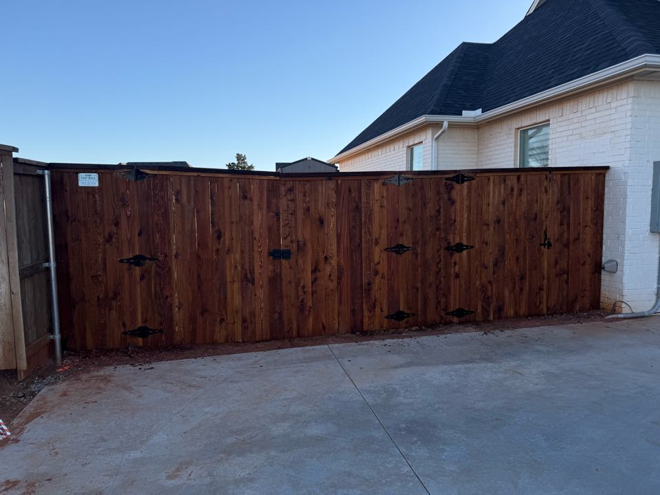 Edmond, OK - Completed a 6’ tall Western Red Cedar fence in the Edmond area, featuring cap &amp; trim, multiple gates, and a fresh stain.