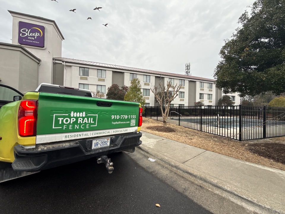 Wilmington, NC - Style: 54in” Belhaven-3 Rail                                  Beautiful Fence done for Sleep Inn!!
