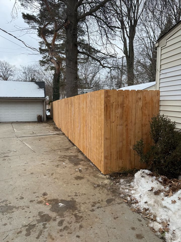 Royal Oak, MI - Our team installed 170 feet of 6 foot tall cedar tone privacy fence in order to add a beautiful and secure perimeter for our customer in Royal Oak, Michigan
