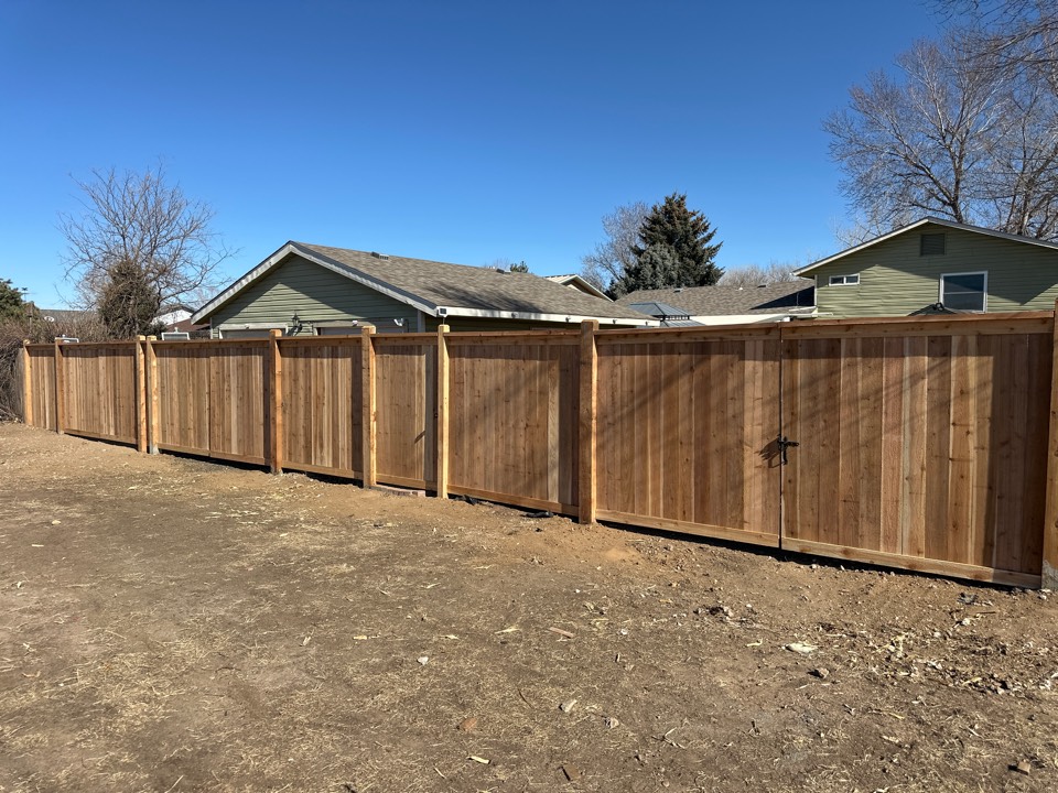 Milliken, CO - Brand new cap and trim fence with 312 foot RV Gates. We also added a ghost control system for the customer to park in their garage. Greeley, Colorado.