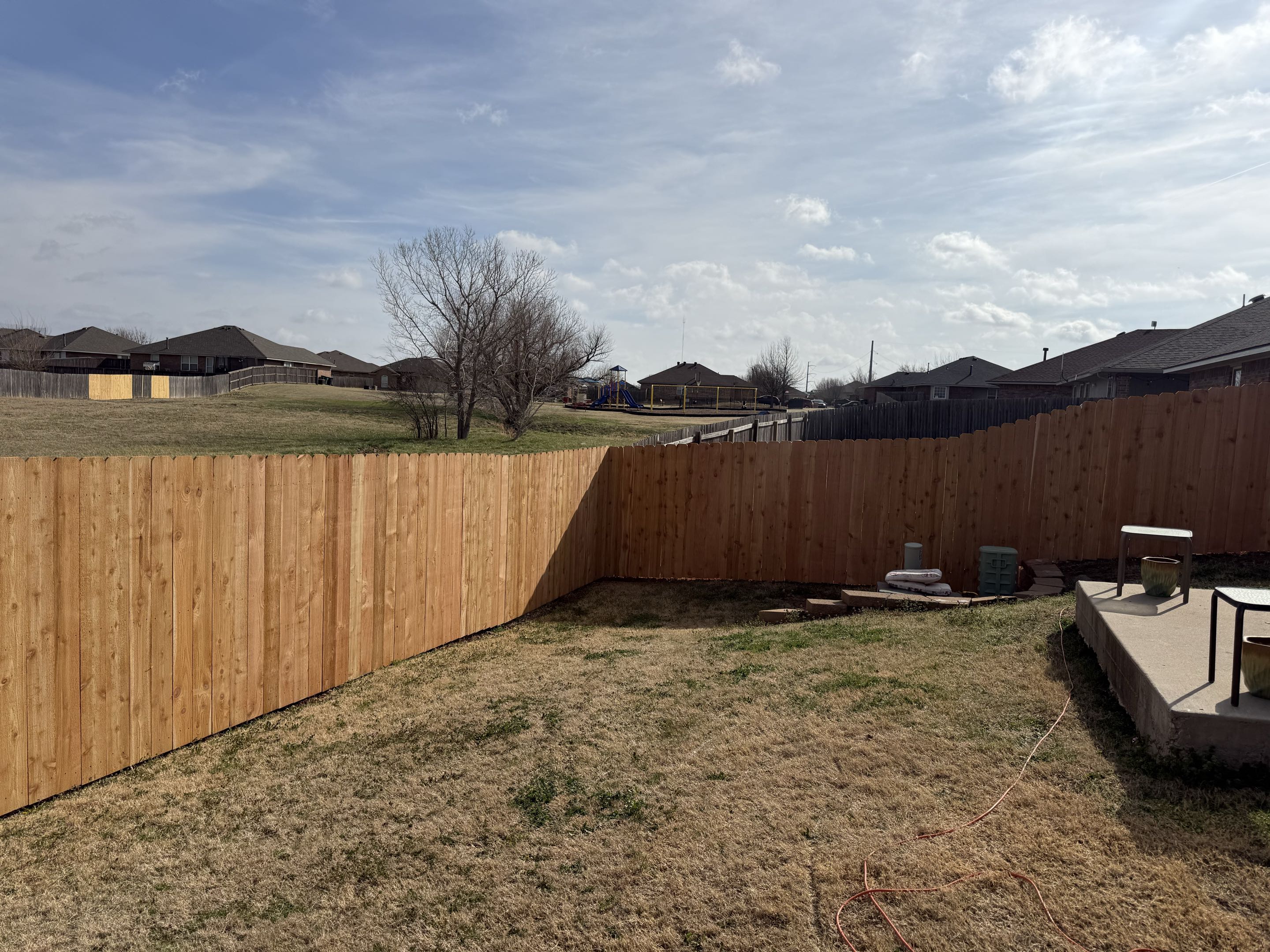 Oklahoma City, OK - Another fence in the books for a great customer from last year — and now we had the privilege of building one for their parents. This 6’ Western Red Cedar privacy fence sits on some rolling ground, but we dialed it in to keep a strong, level top line while following the natural grade.