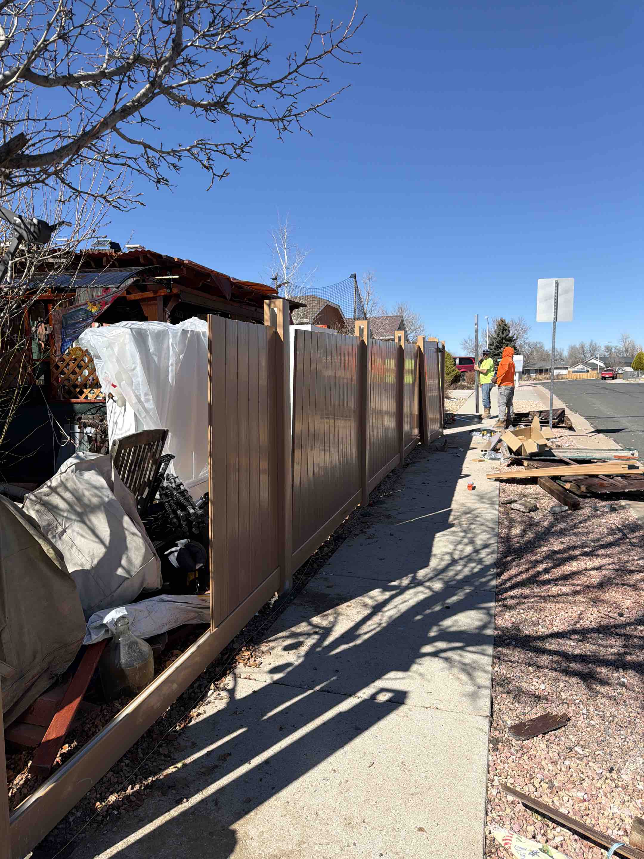 Colorado Springs, CO - The Top Rail Fence Team is in Colorado Springs installing a brand new Privacy Catalyst Cypress-Colored Fence!
