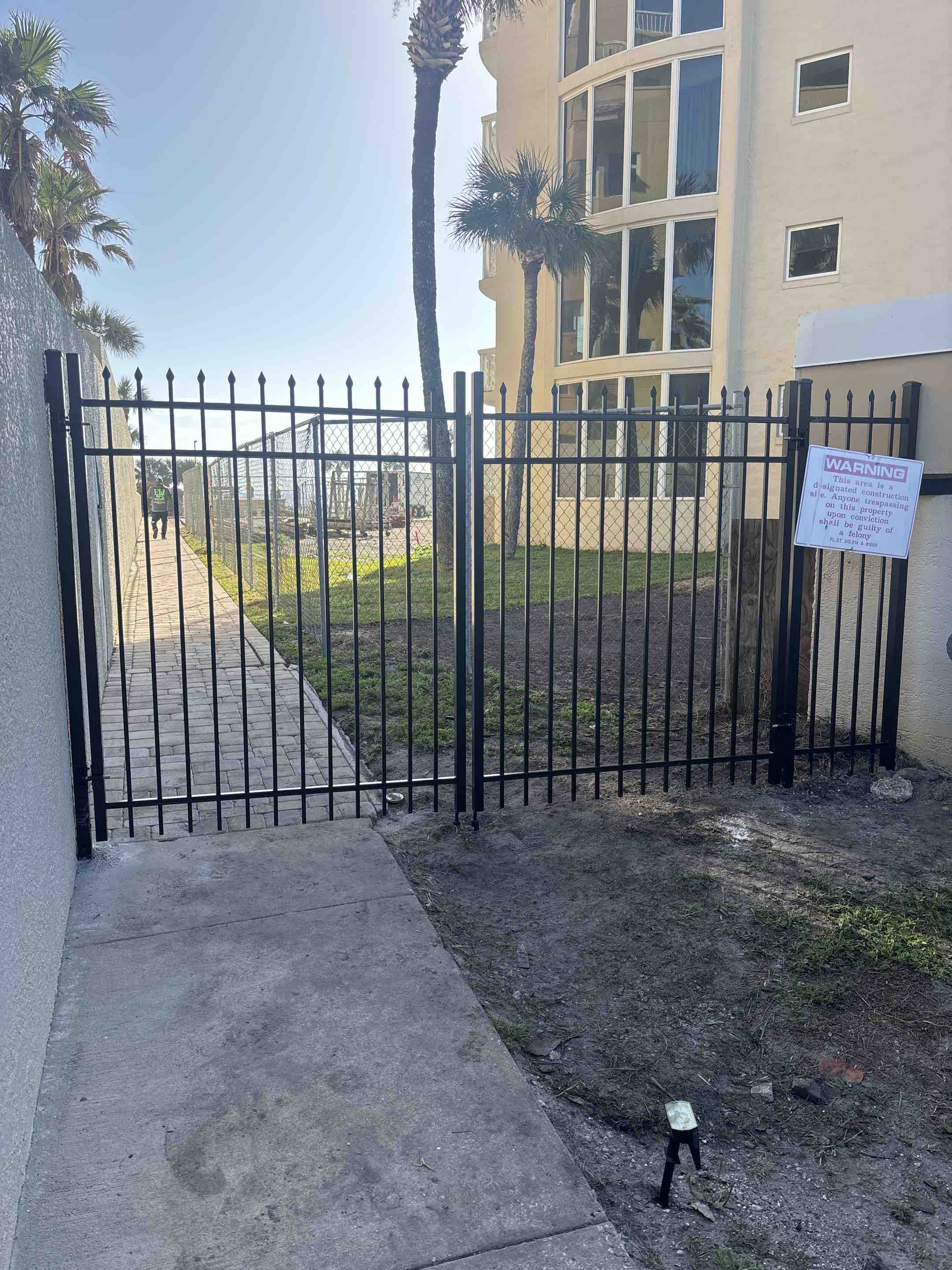 New Smyrna Beach, FL - Installed 6’ height pressed spear top aluminum double gate for condominium in New Smyrna this morning! 