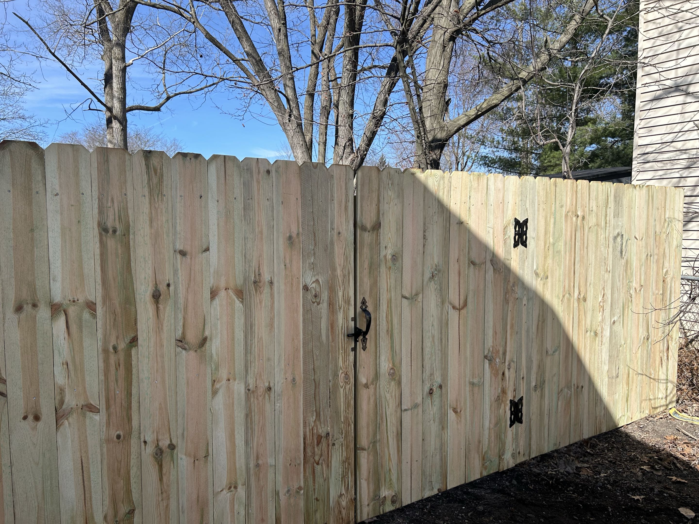 Ypsilanti, MI - Top Rail Fence Ann Arbor is in Ypsilanti Township and just completed removal of an old chain link fence and gate. We replaced it with a dog ear picket privacy fence to enhance the home’s curb appeal.
