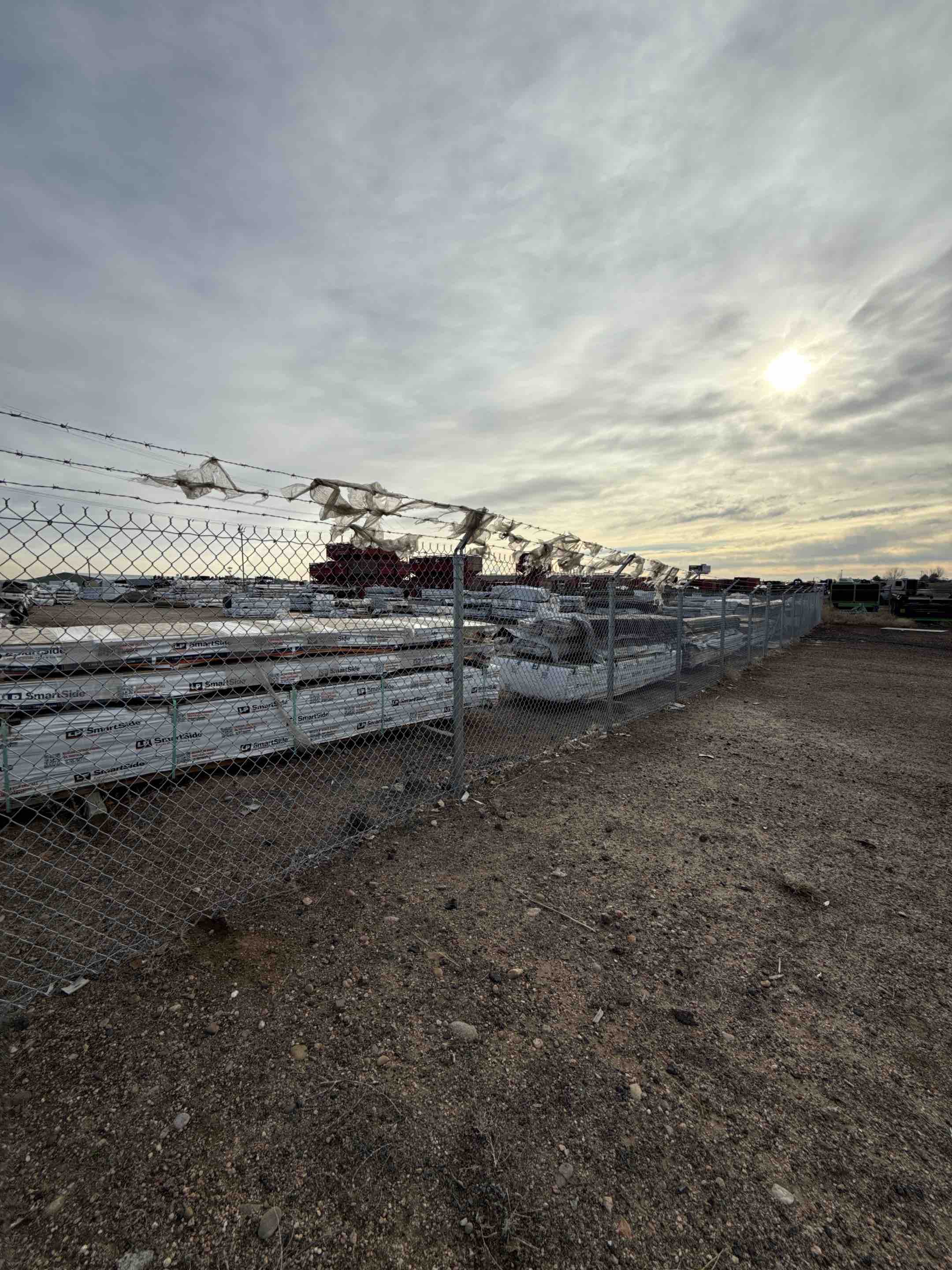 Henderson, CO - Top Rail Fence recently completed a project involving the installation of a 6-foot high chain-link fence with added barbed wire for enhanced security. The client sought to expand their storage area, requiring a robust and durable fencing solution. The project involved precise measurements, careful planning, and the installation of high-quality materials to ensure the fence met both aesthetic and functional needs. The barbed wire was added to deter unauthorized access, providing an extra layer of protection. The team worked efficiently to complete the project on time, ensuring the client's storage area was secure and well-defined.