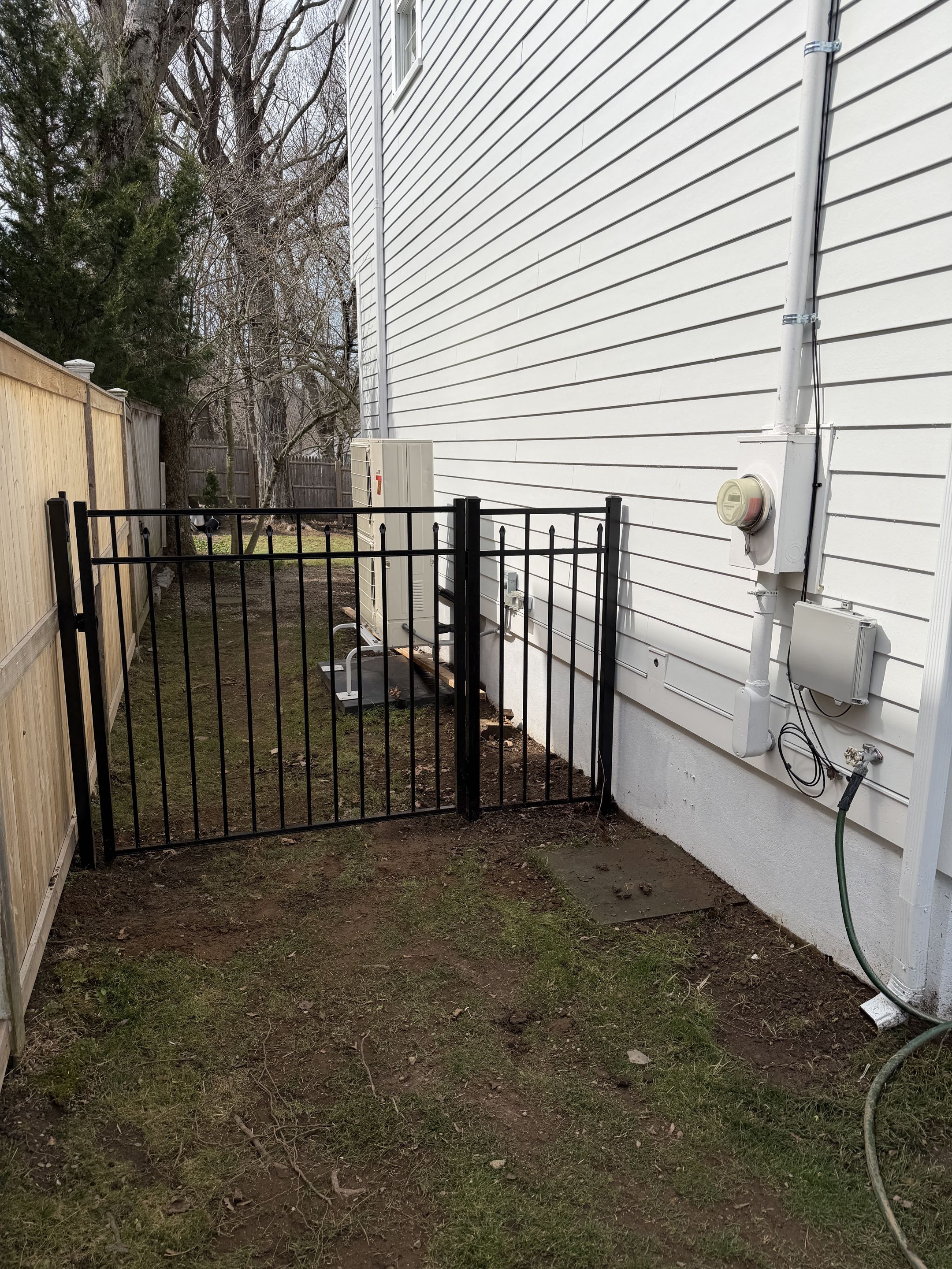 Westport, CT - Just finished a new black aluminum fence and gates. A small job but an important one to keep the dogs safe inside!