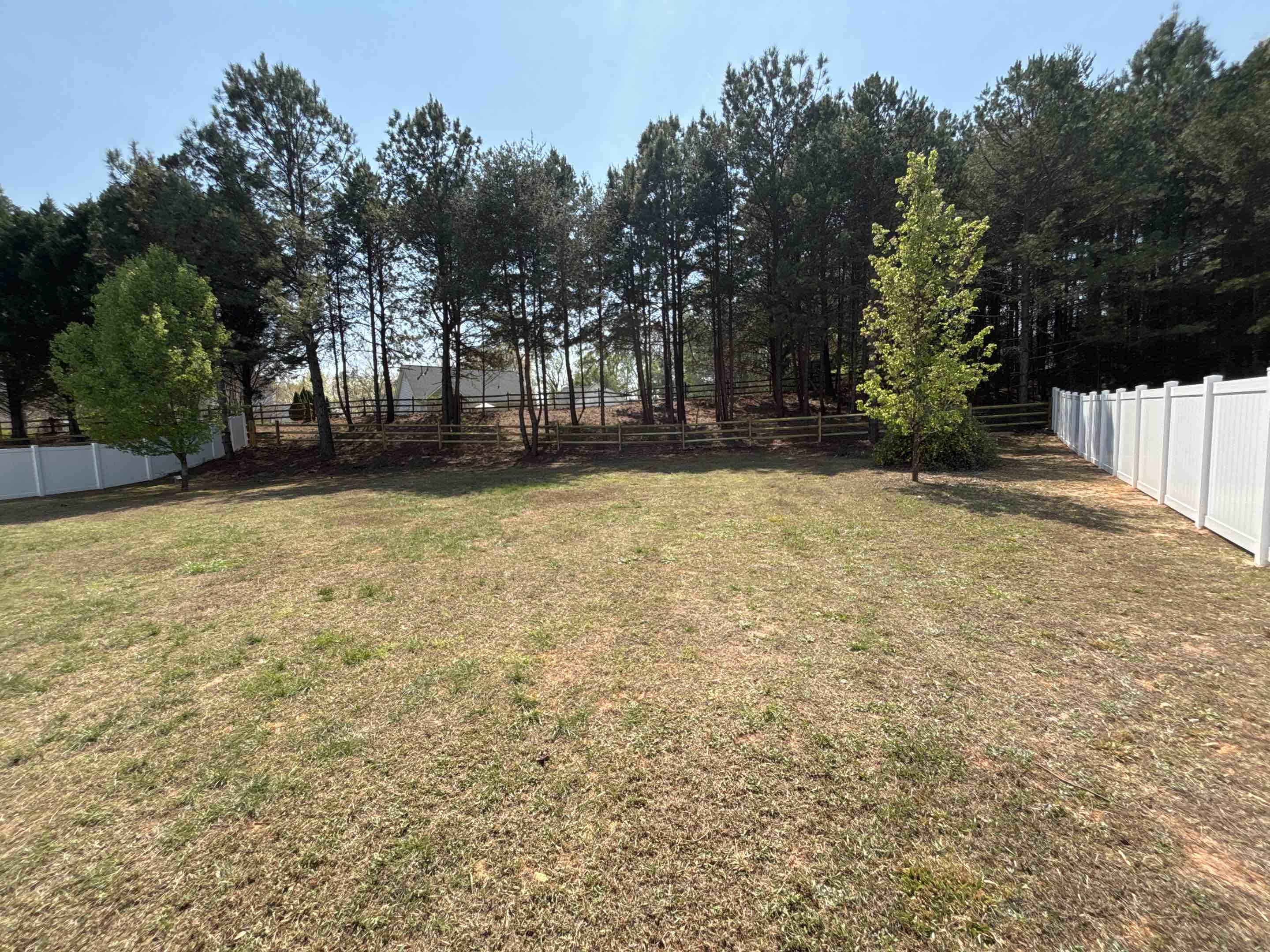 Huntersville, NC - White vinyl privacy and split rail