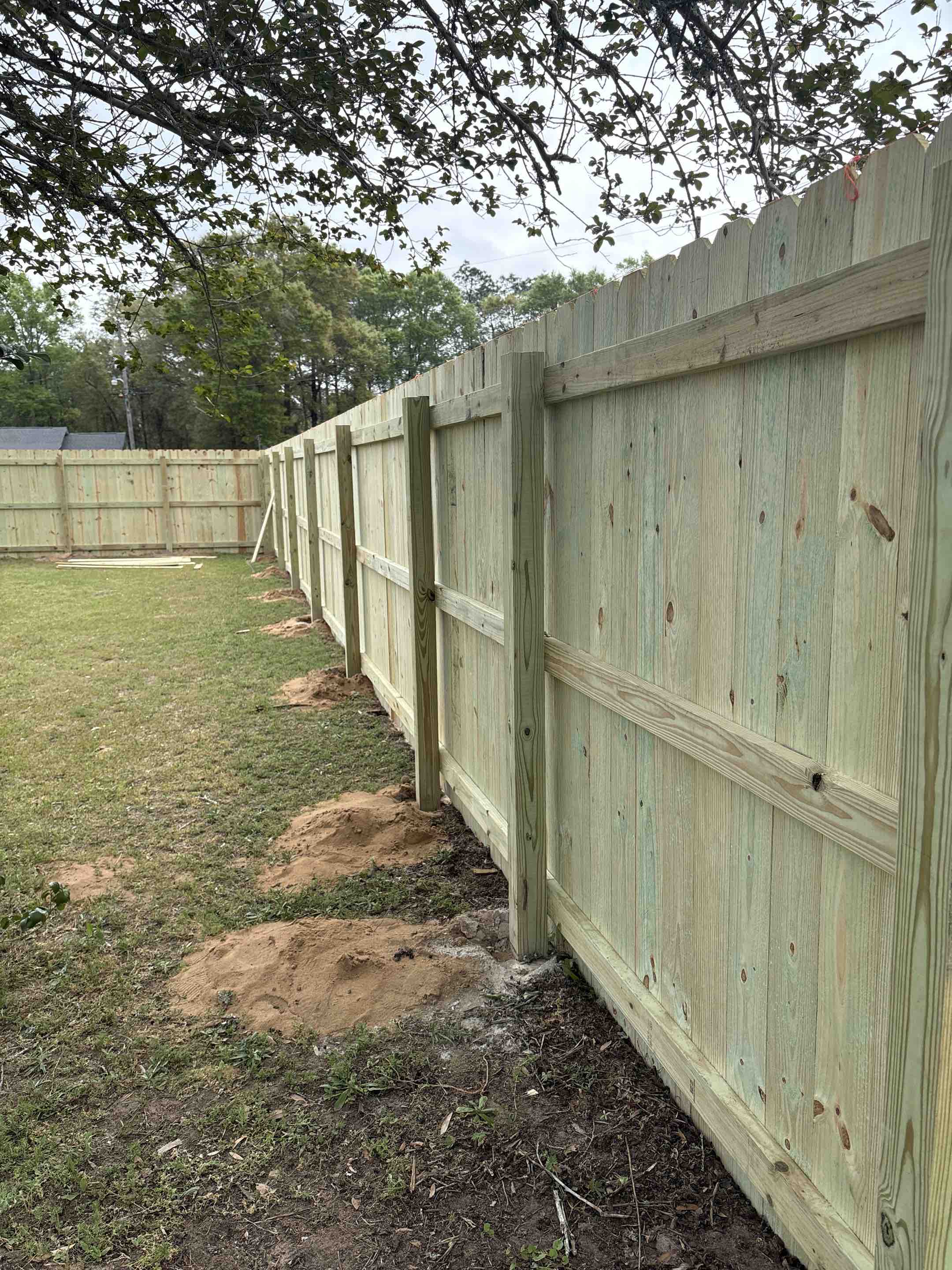 Milton, FL - Replacing an old worn out wood fence with a beautiful new one! What a difference!