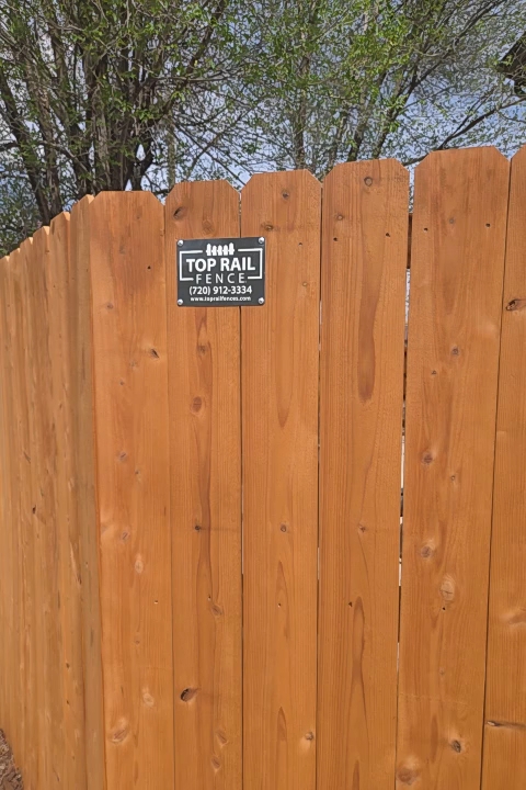 Denver, CO - this customer is going to make a custom still archway to go in this 10 ft opening that leads to his front garden. steel post 6 ft high cedar fence with hog panel in the front. 