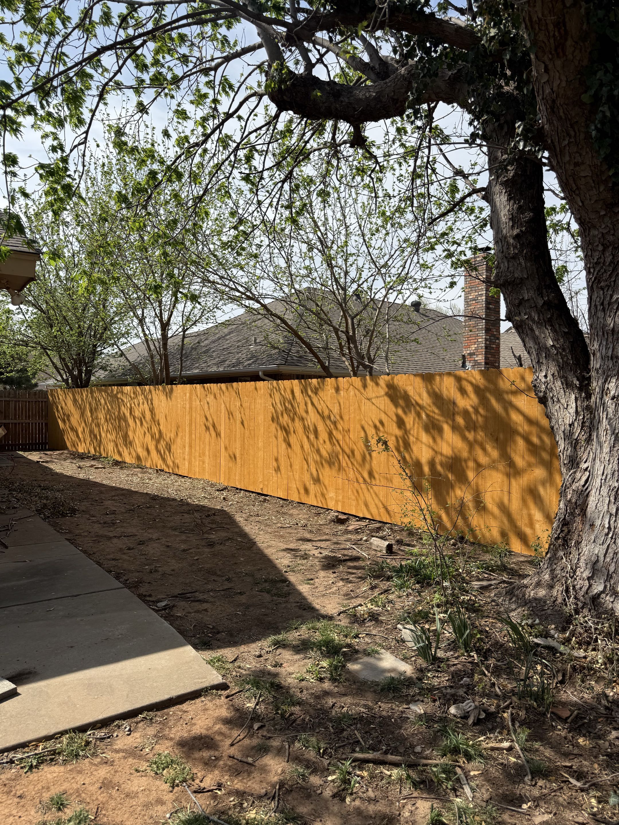 Oklahoma City, OK - This homeowner can now enjoy peace of mind with a beautiful 6-ft privacy fence—keeping the pups safe and secure in their backyard.