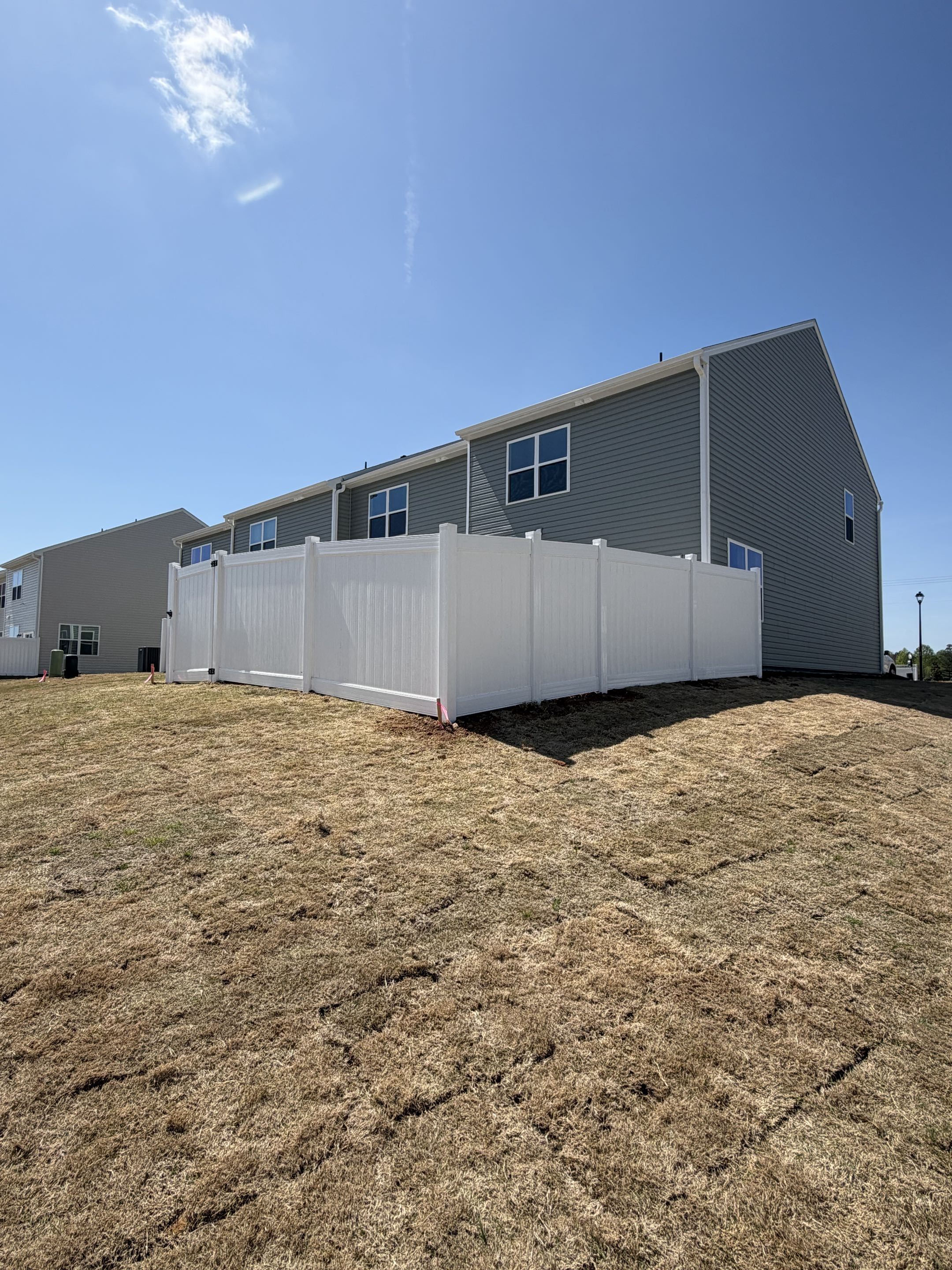 Clayton, NC - hite vinyl privacy fence installed in just half a day, delivering a clean, durable upgrade that enhances curb appeal and security. This low-maintenance fence creates a private backyard retreat while providing a safe, enclosed space for pets to roam freely. Expert installation ensures long-lasting performance, making it a perfect solution for homeowners seeking privacy, safety, and style.