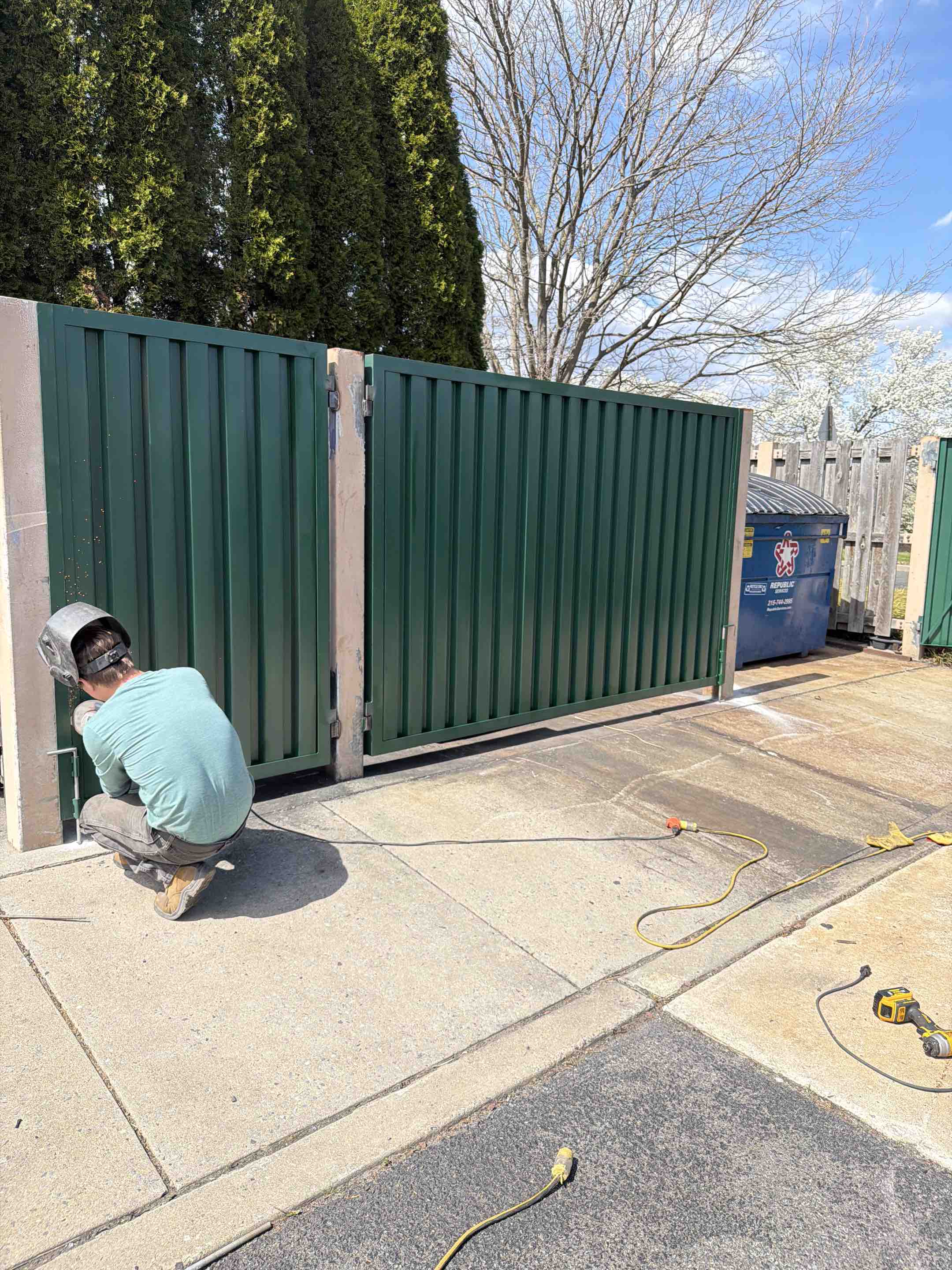 Westampton Township, NJ - Corrugated metal gates for dumpster containment at a country club in Westampton.