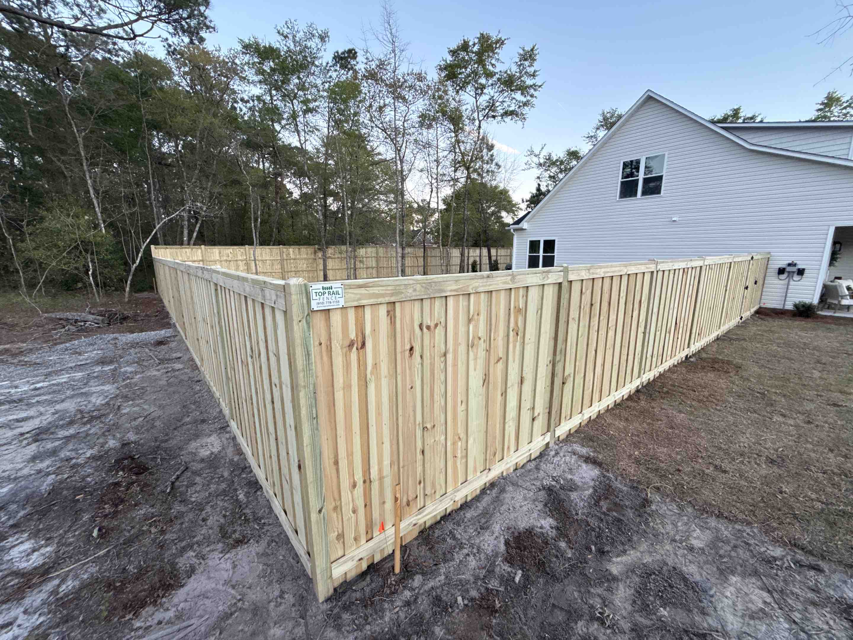 Leland, NC - 6ft and 8ft Board on Board w/ top and bottom trim; post ends trimmed to 45’ pyramid top