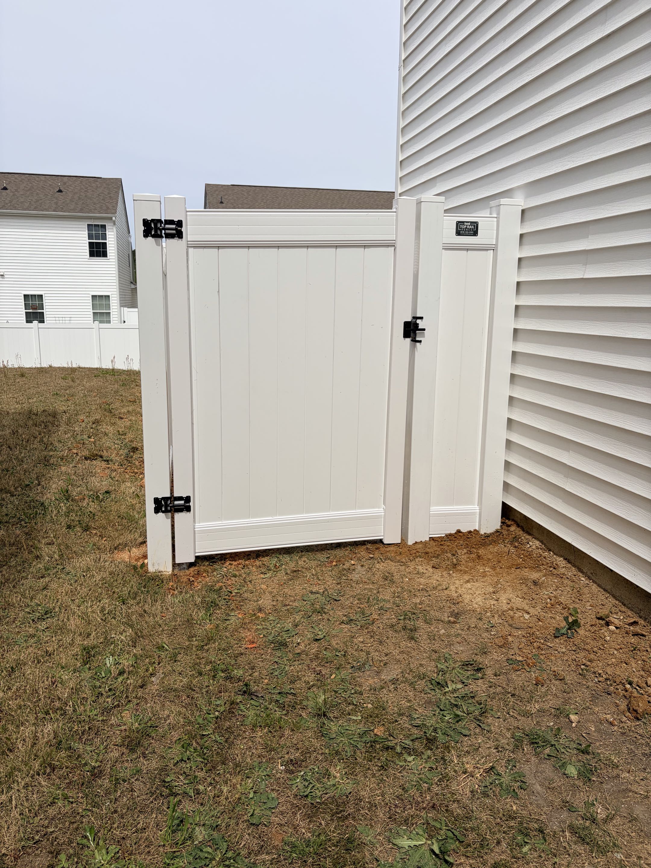 Clayton, NC - A beautiful privacy white vinyl fence installed to provide increased safety for puppies and increase curb appeal! 