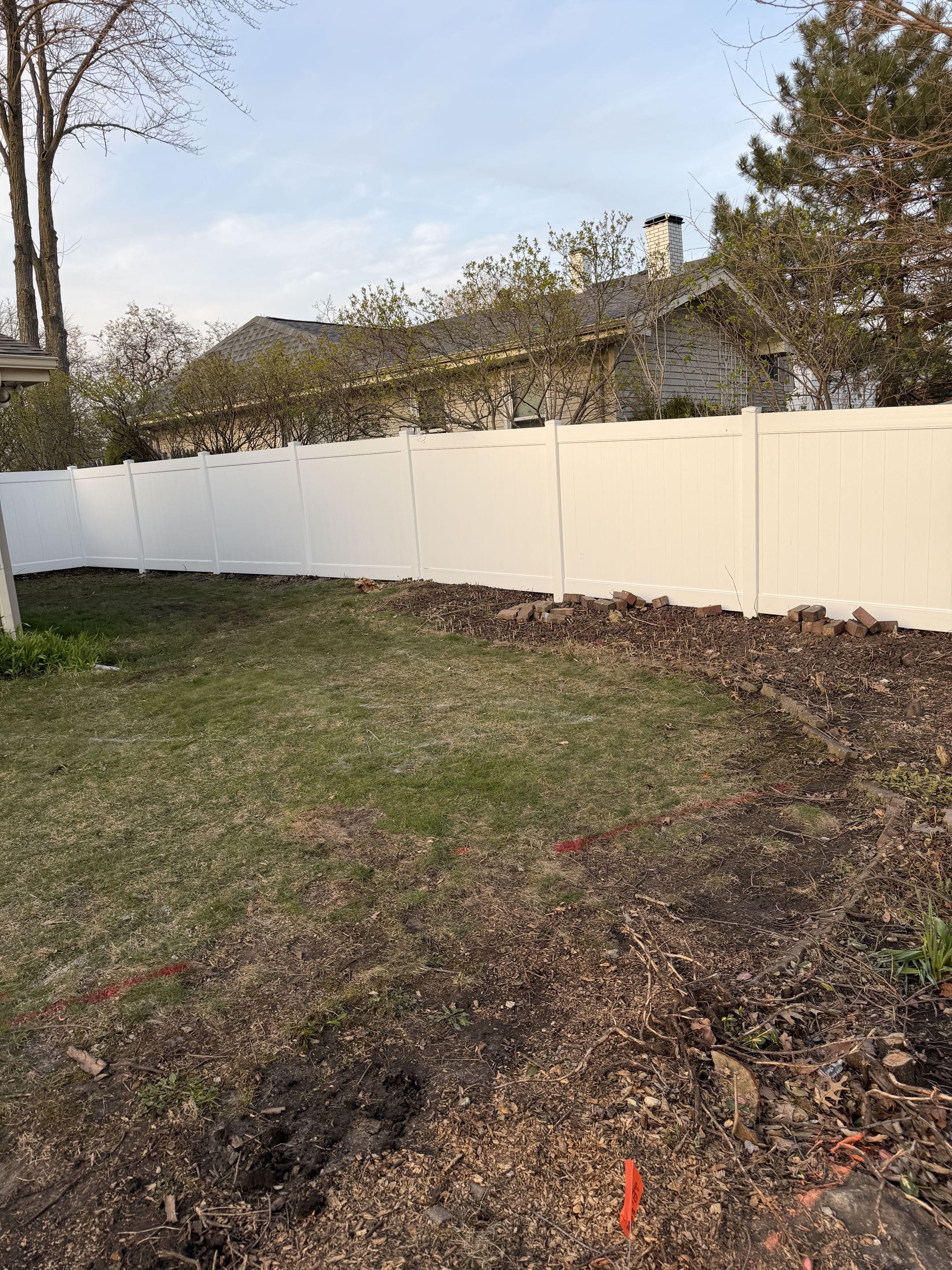 Bolingbrook, IL - A homeowner recently chose to enhance their yard with a new white privacy vinyl fence. They selected our services based on our 5-star reviews and the premium quality of our materials. The project began with a thorough consultation to understand their needs and preferences. We then designed a custom fence layout that maximized privacy while complementing the home's aesthetic. Installation involved precise measurements, ensuring each section was perfectly aligned. The vinyl material was chosen for its durability and low maintenance. Post-installation, we conducted a final inspection to ensure everything met the highest standards. The homeowner was thrilled with the result, enjoying their new, beautifully private yard.
