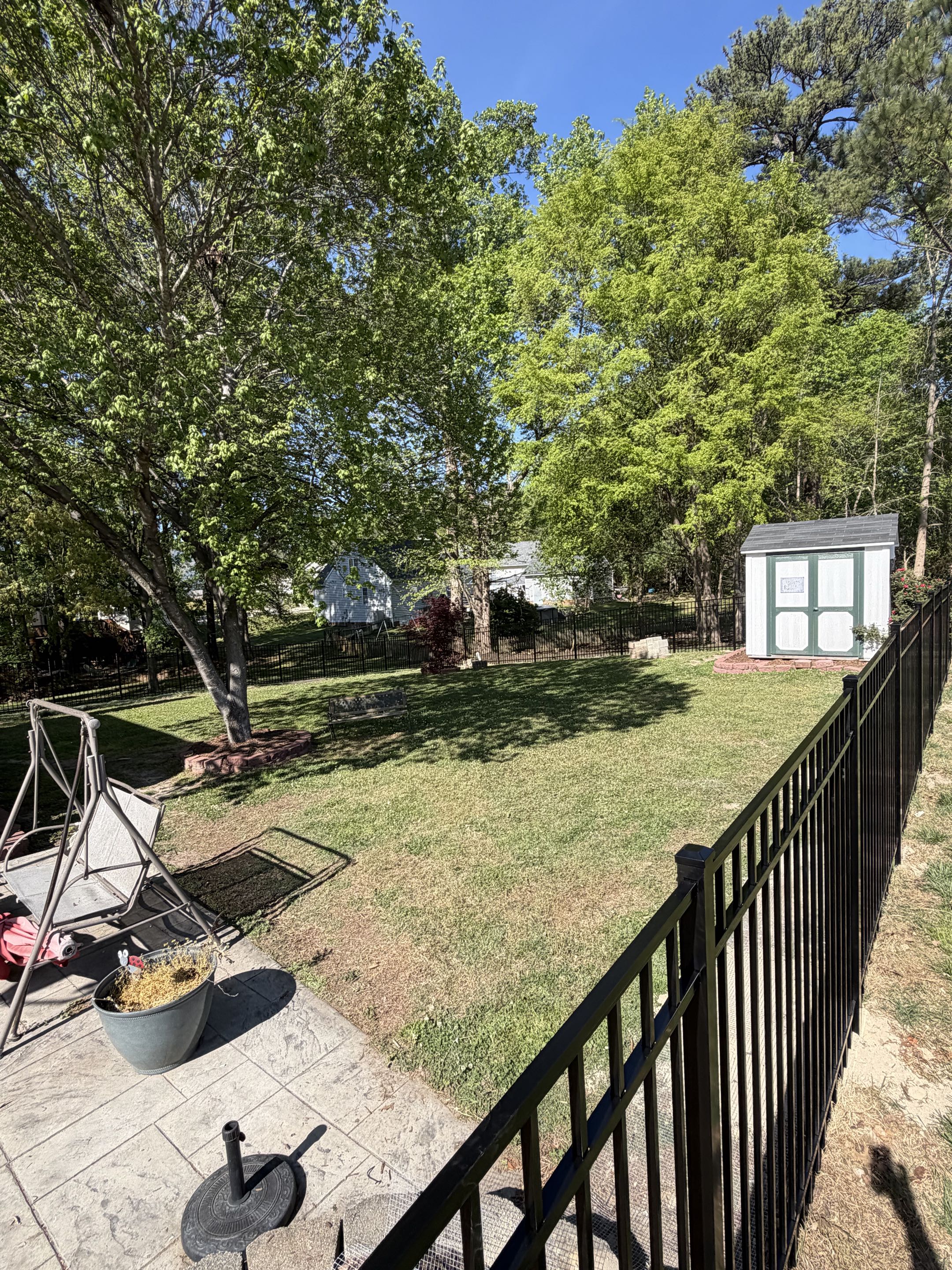 Raleigh, NC - Installed a 5-ft high, 3-rail black aluminum fence to create a secure backyard enclosure for dogs. This durable, low-maintenance fencing solution enhances safety while maintaining an open, modern look. Perfect for pet containment, this aluminum fence provides peace of mind and long-lasting performance.