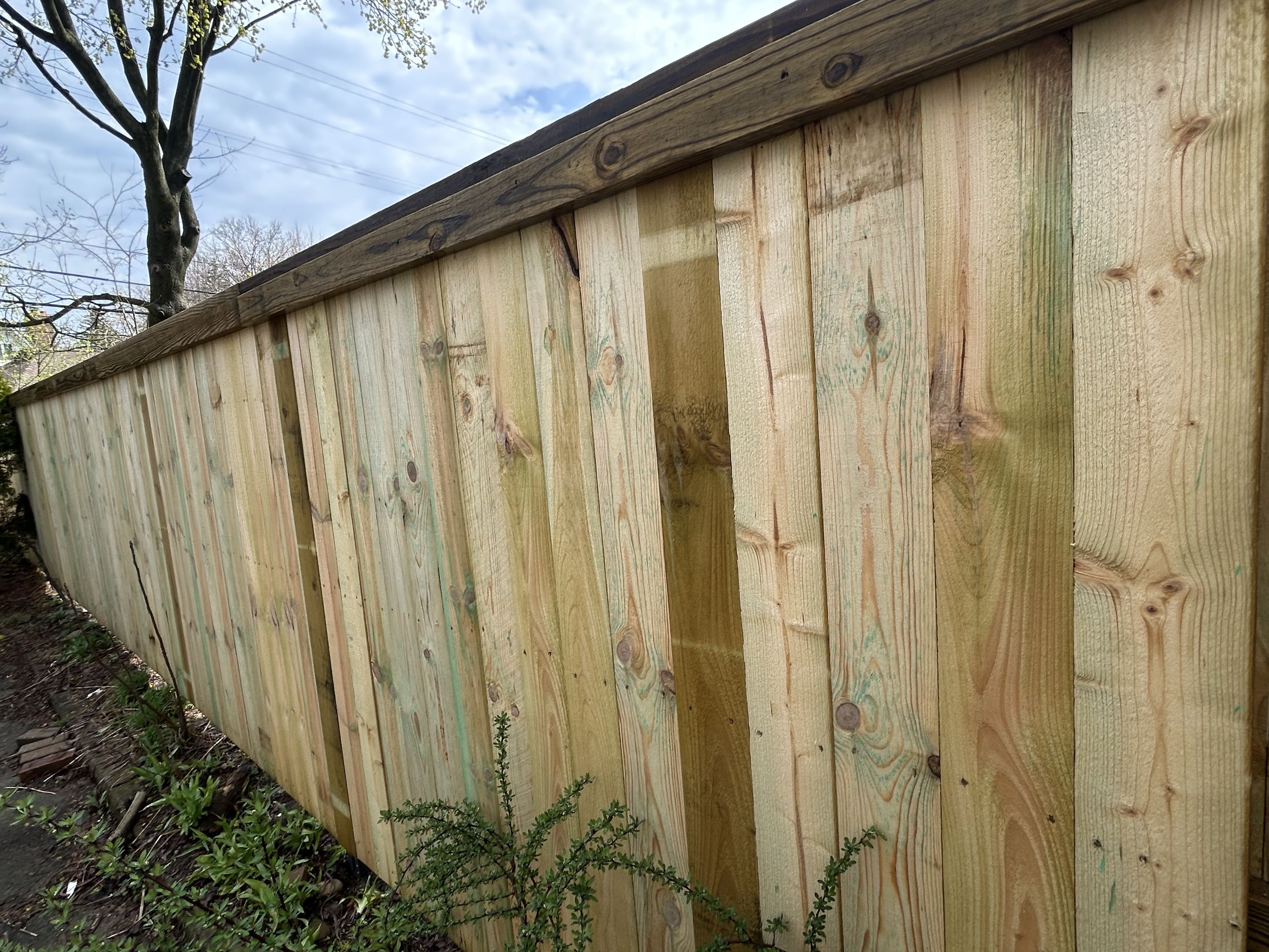 Ann Arbor, MI - Top roof fence was in Ann Arbor, Michigan, completing cap and trim wood fence.  With Postmasters if withstood the tornado force winds last night