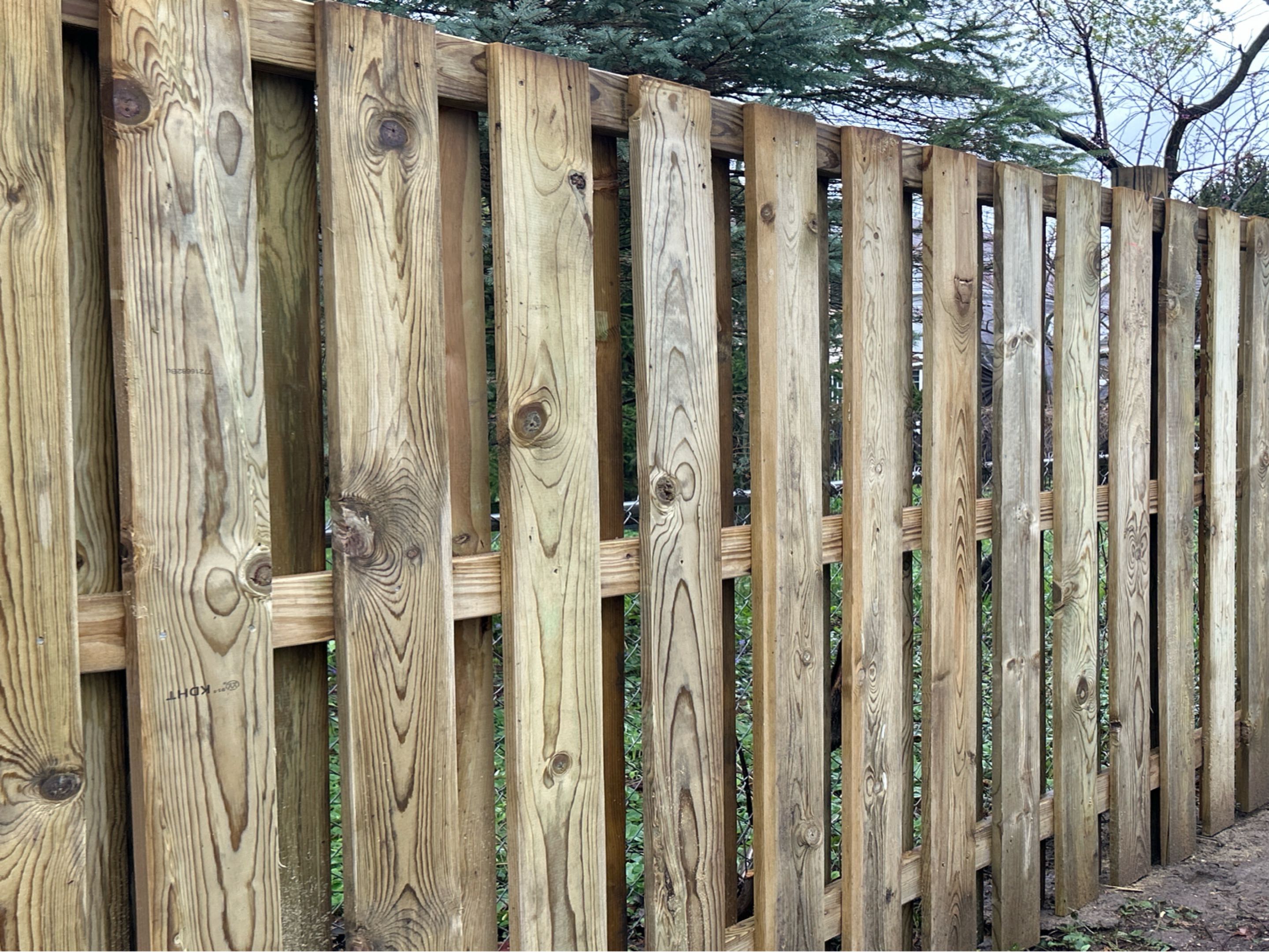 Ann Arbor, MI - It’s rainy but we finished this one after the wind storms.  It’s a unique shadowbox style.  The customer is very happy with Top Rail Fence!