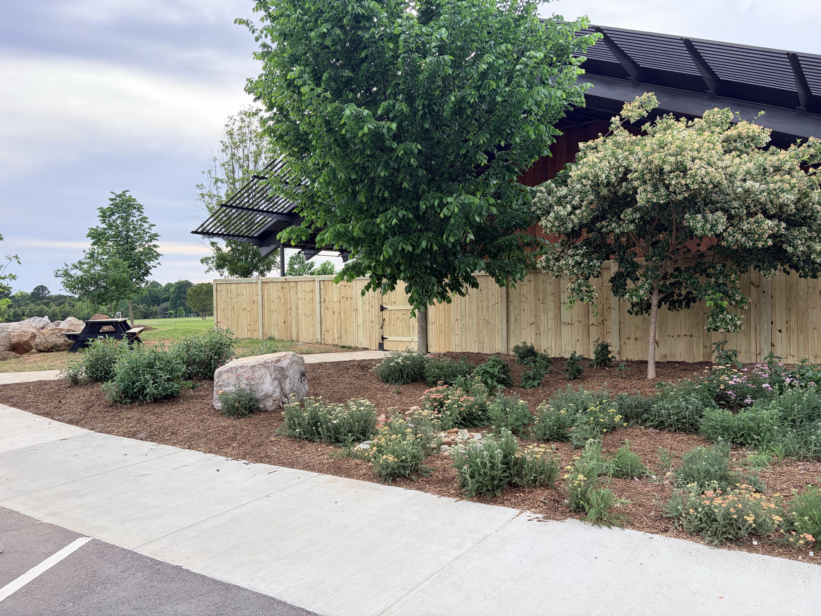 Raleigh, NC - A double-sided cap and trim fence was installed to enhance safety at a preschool. Each fence post was fitted with a double-sided cap, providing a smooth, rounded edge to prevent injuries. The trim was carefully attached to the fence, ensuring it was tight and secure. The final result was a safer environment for the children, providing peace of mind for parents and staff.