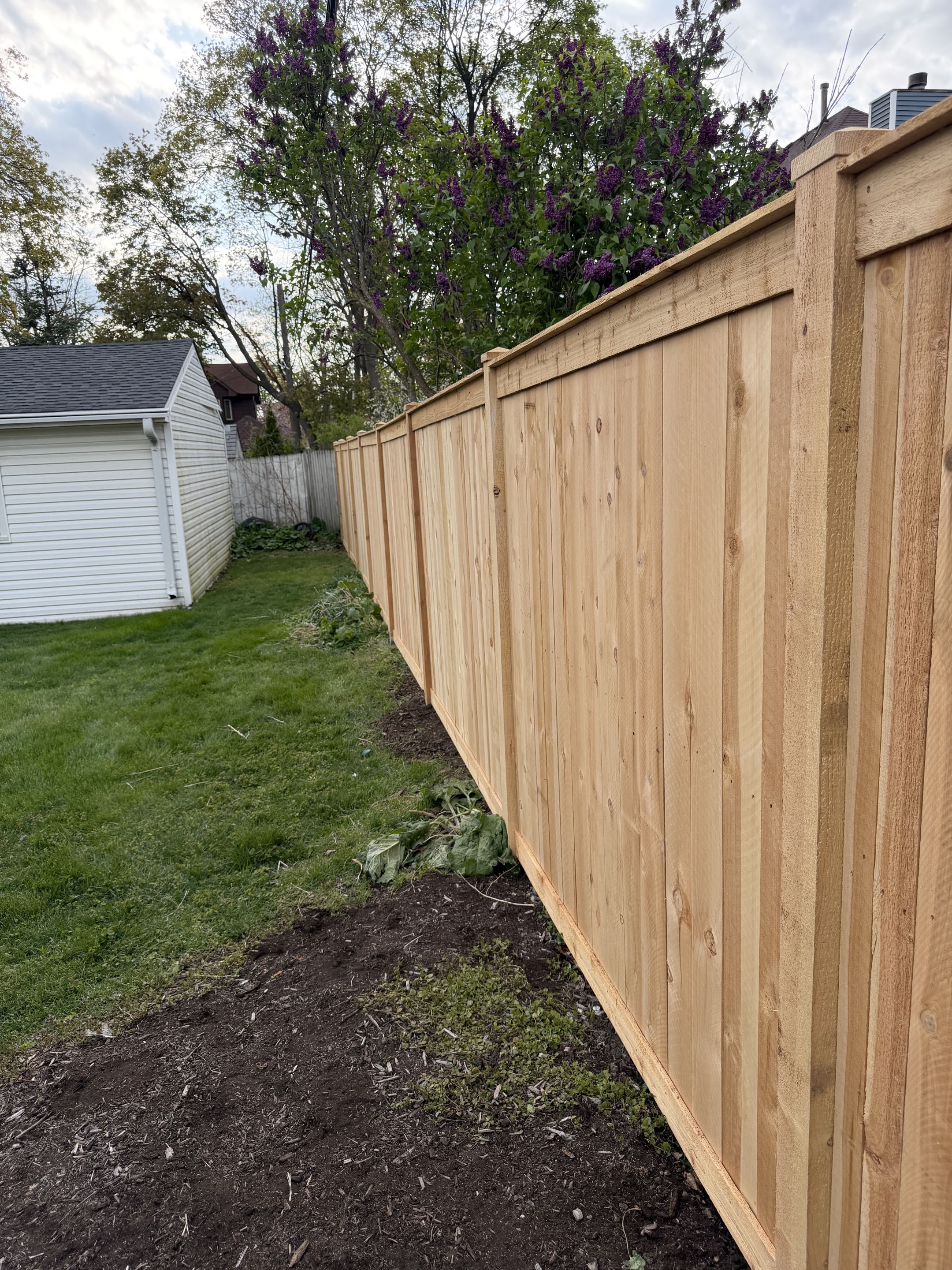 Wheaton, IL - A customer required a section of their fence to be replaced due to wear and tear. They opted for a more refined look than basic wood privacy. We installed a 6’ Charleston style cedar Top Rail fence, enhancing the property's aesthetic. The cedar material was chosen for its durability and natural beauty, The result was a visually appealing and sturdy fence that met the customer's expectations.