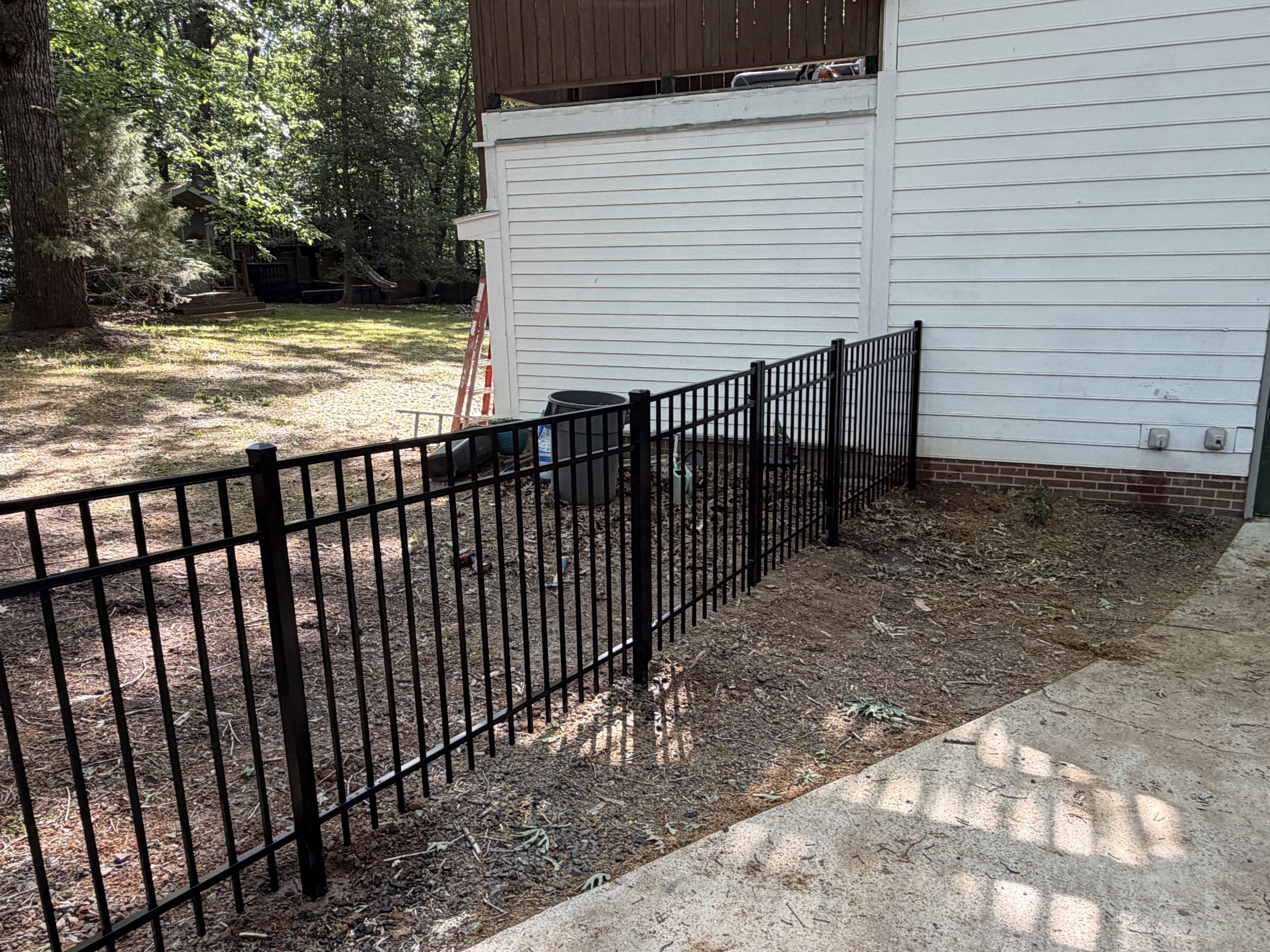 Wake Forest, NC - 42 feet of 4’ high 3-rail black aluminum fence installed with a double gate to fully enclose the yard and keep pets safe and secure in the backyard. Durable, low-maintenance, and clean modern look that enhances curb appeal while providing peace of mind for pet owners. Expert installation ensures long-lasting performance and functionality.  #BlackAluminumFence #AluminumFence #PetFence #BackyardFence #FenceInstallation #DurableFencing #ModernFence #SecureYard