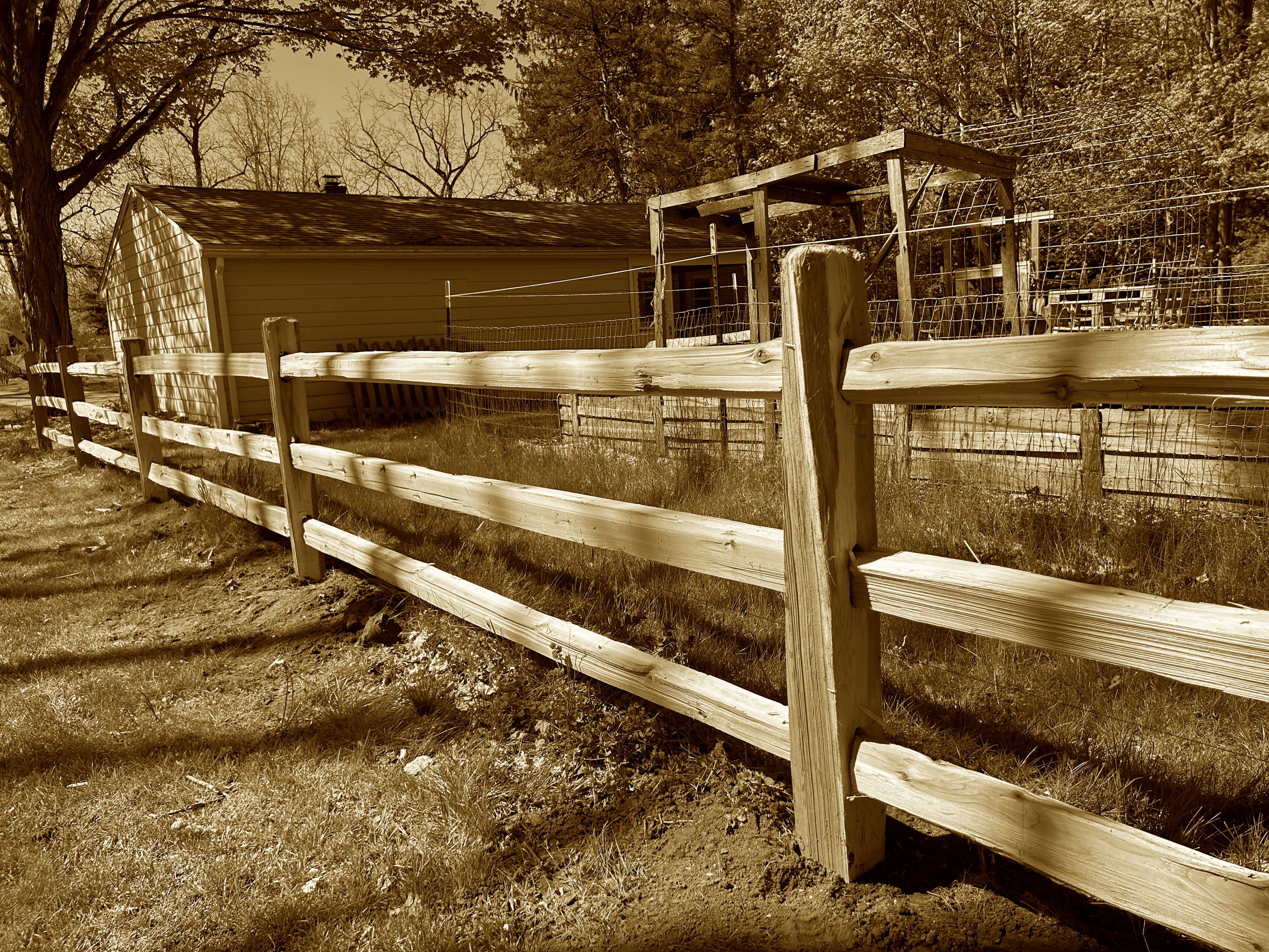 Ann Arbor, MI - Top Rail Fence is in superior Township today working on a rustic cedar split rail fence to divide the properties.