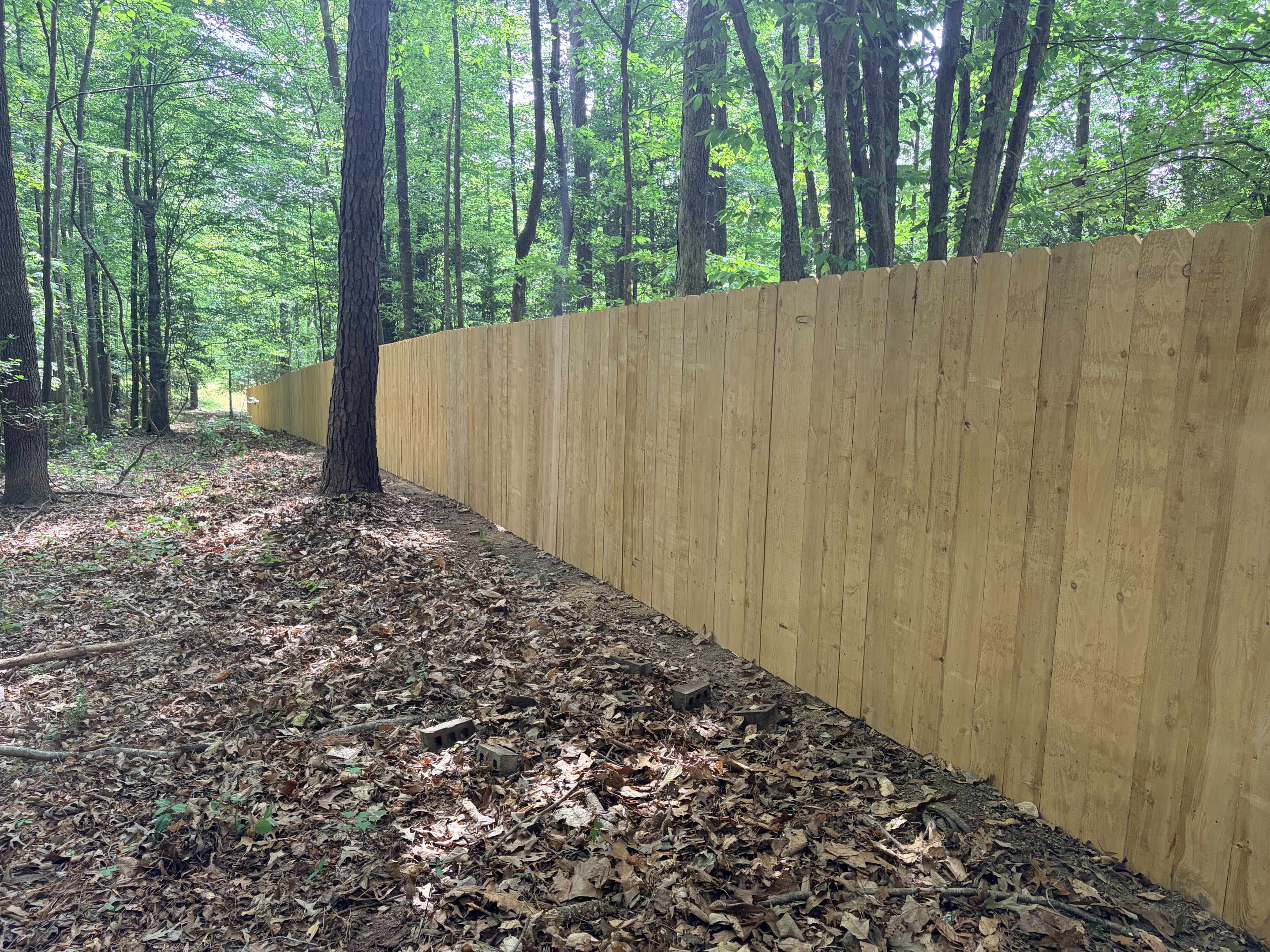 Raleigh, NC - 275 linear feet of 6H wood privacy fence installed for a very happy customer!