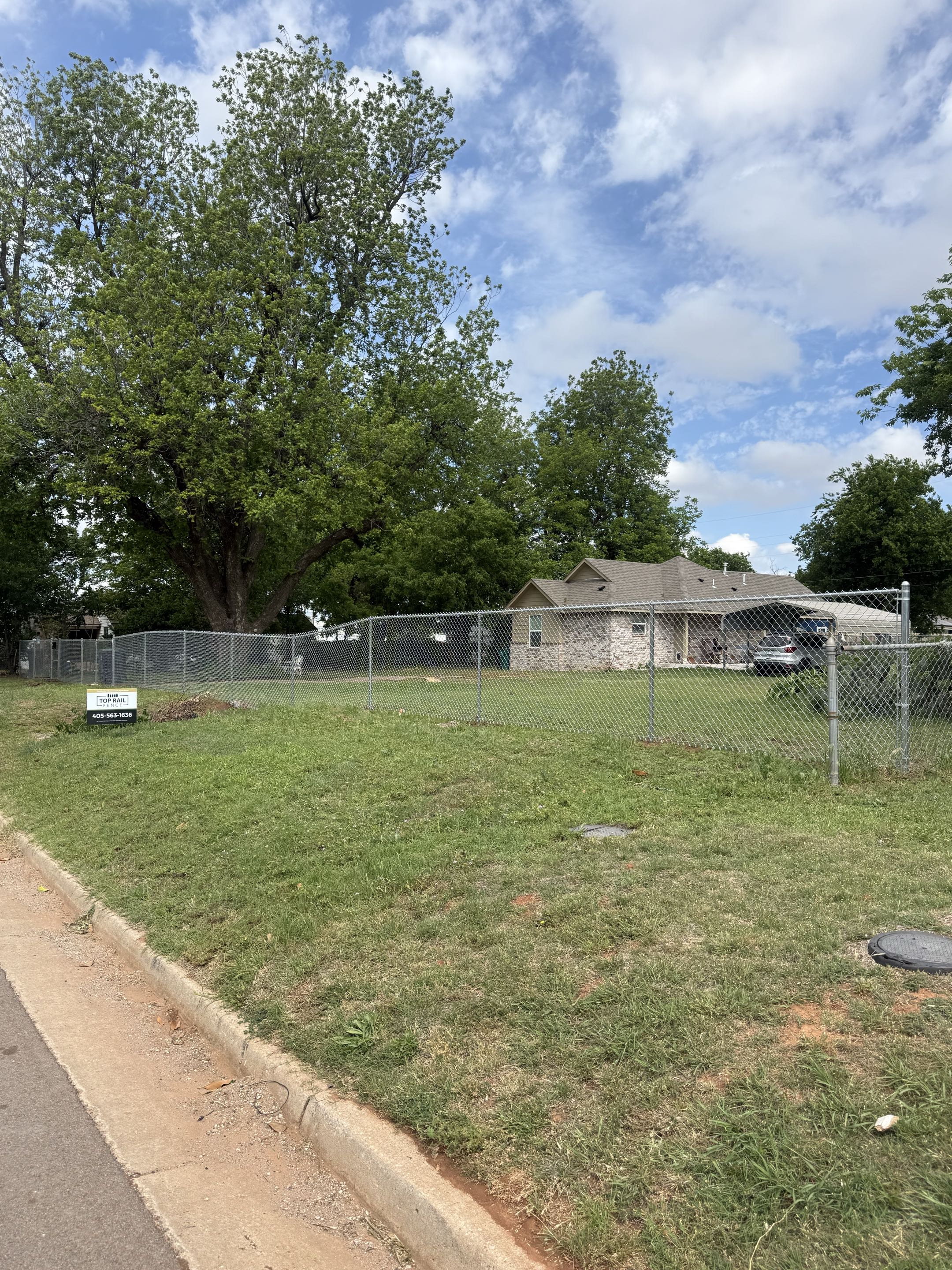 Oklahoma City, OK - The homeowners wanted a way for their pets to enjoy the full backyard without worry—this 5’ tall chain link fence was the perfect solution.