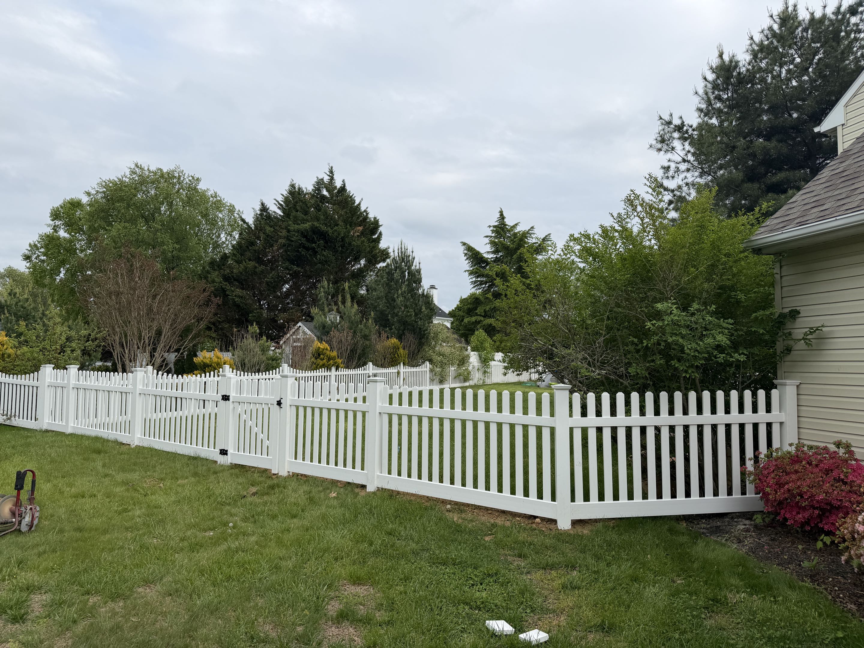 Harrison Township, NJ - Beautiful white vinyl picket fence install in Mullica Hill.