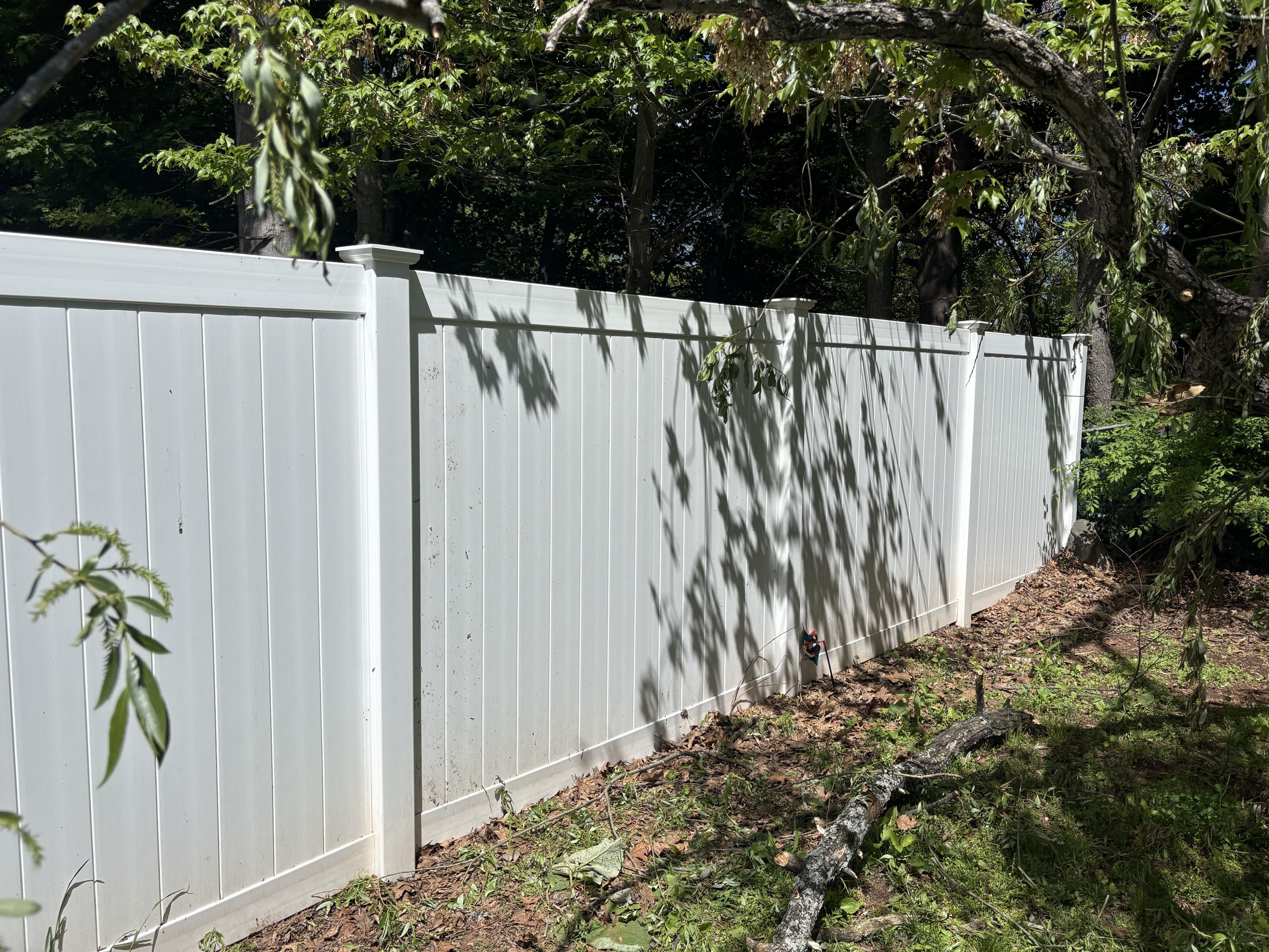 New Britain, CT - Fallen branch destroys vinyl fence top rail. Top Rail Fence to the rescue.