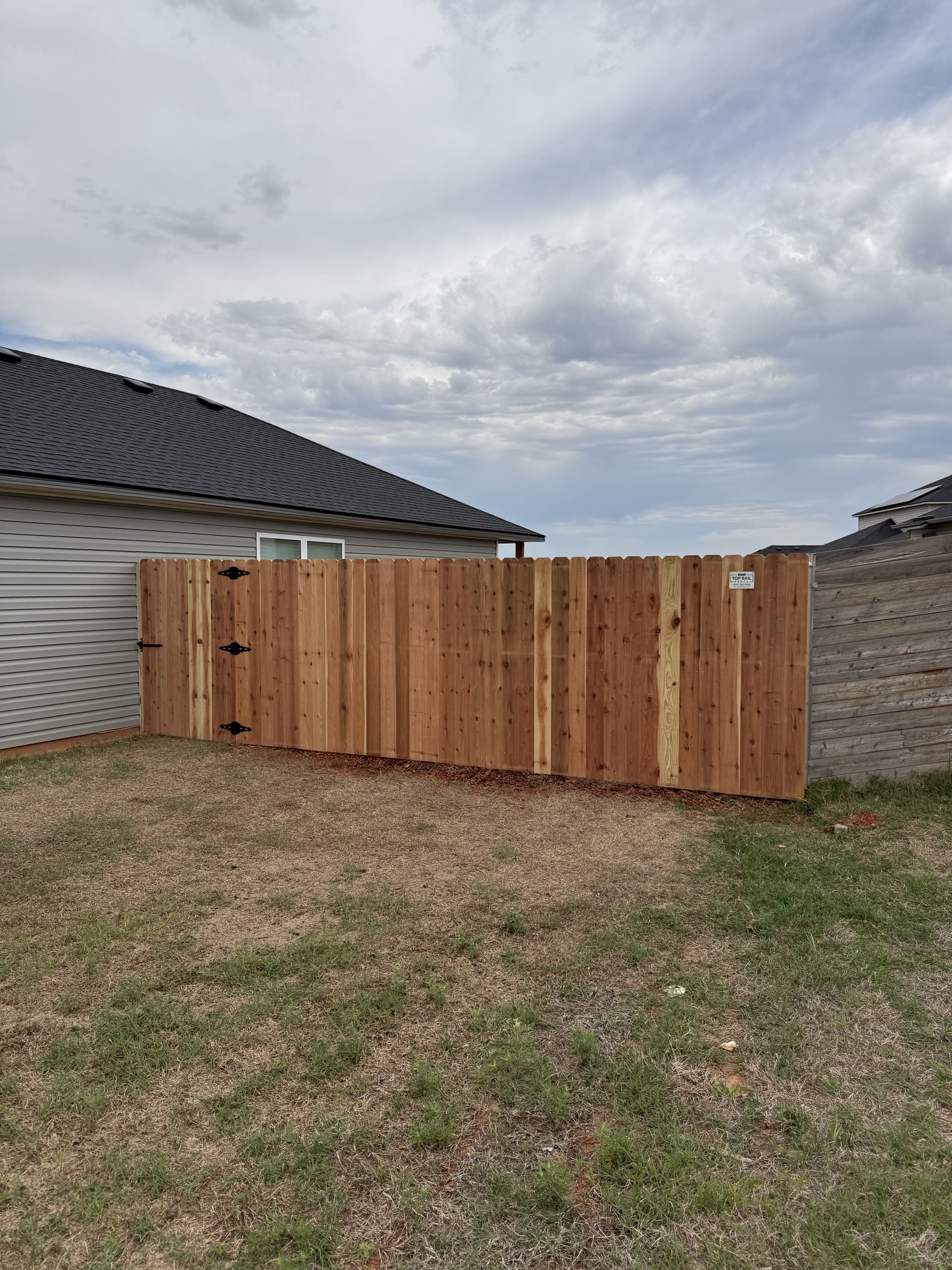 Oklahoma City, OK - Just finished up this stunning 6’ Japanese cedar privacy fence in a brand new home addition. The natural cedar color gives this backyard a warm, modern look while adding the privacy every homeowner wants. Simple, clean, and built right.