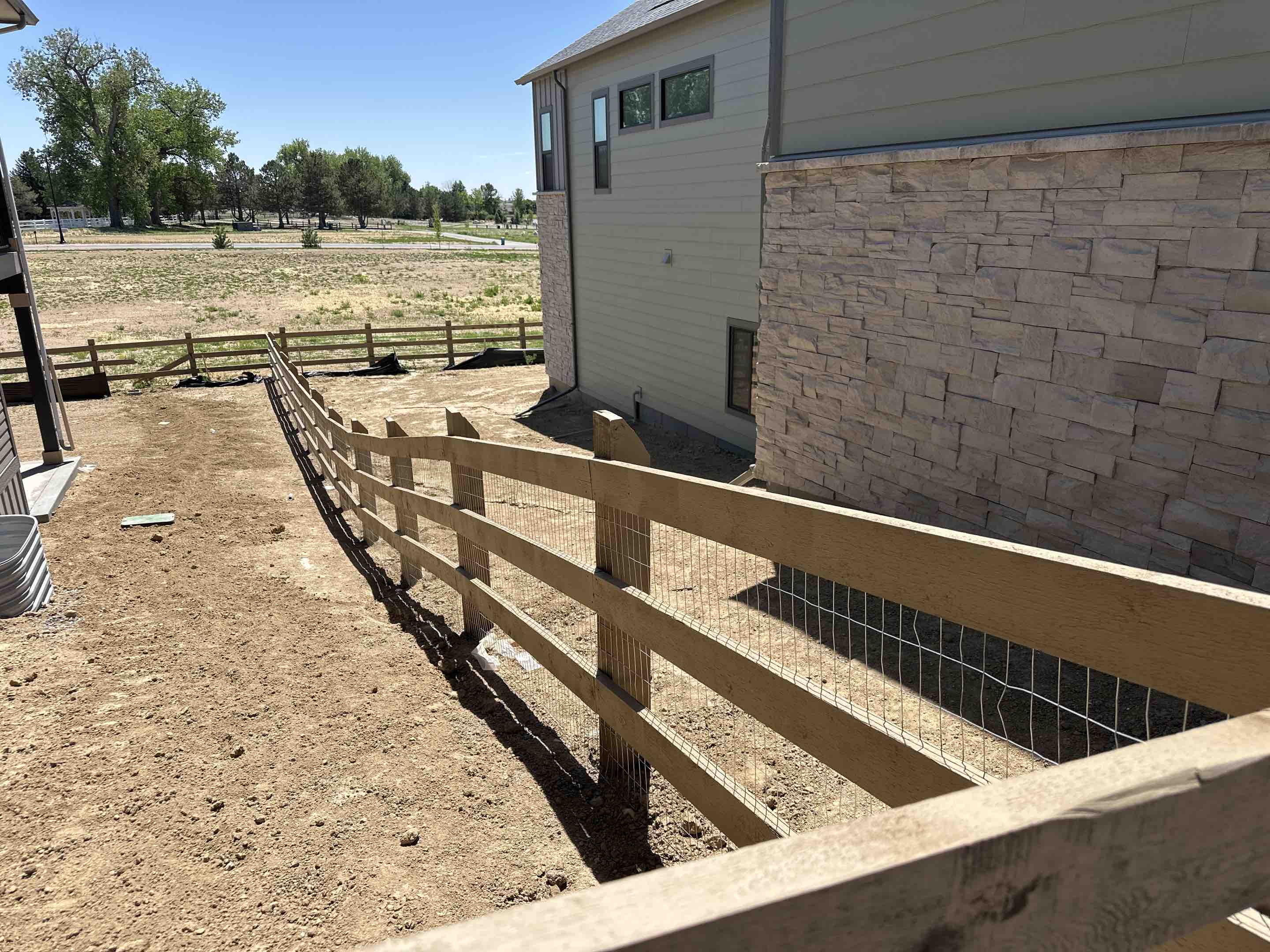 Timnath, CO - Another beautiful fence for the books.  Top Rail Fence just finished up completing a new homeowner’s house with 6 x 6 post, 2 x 6 rails and welded wire on a three rail ranch fence.