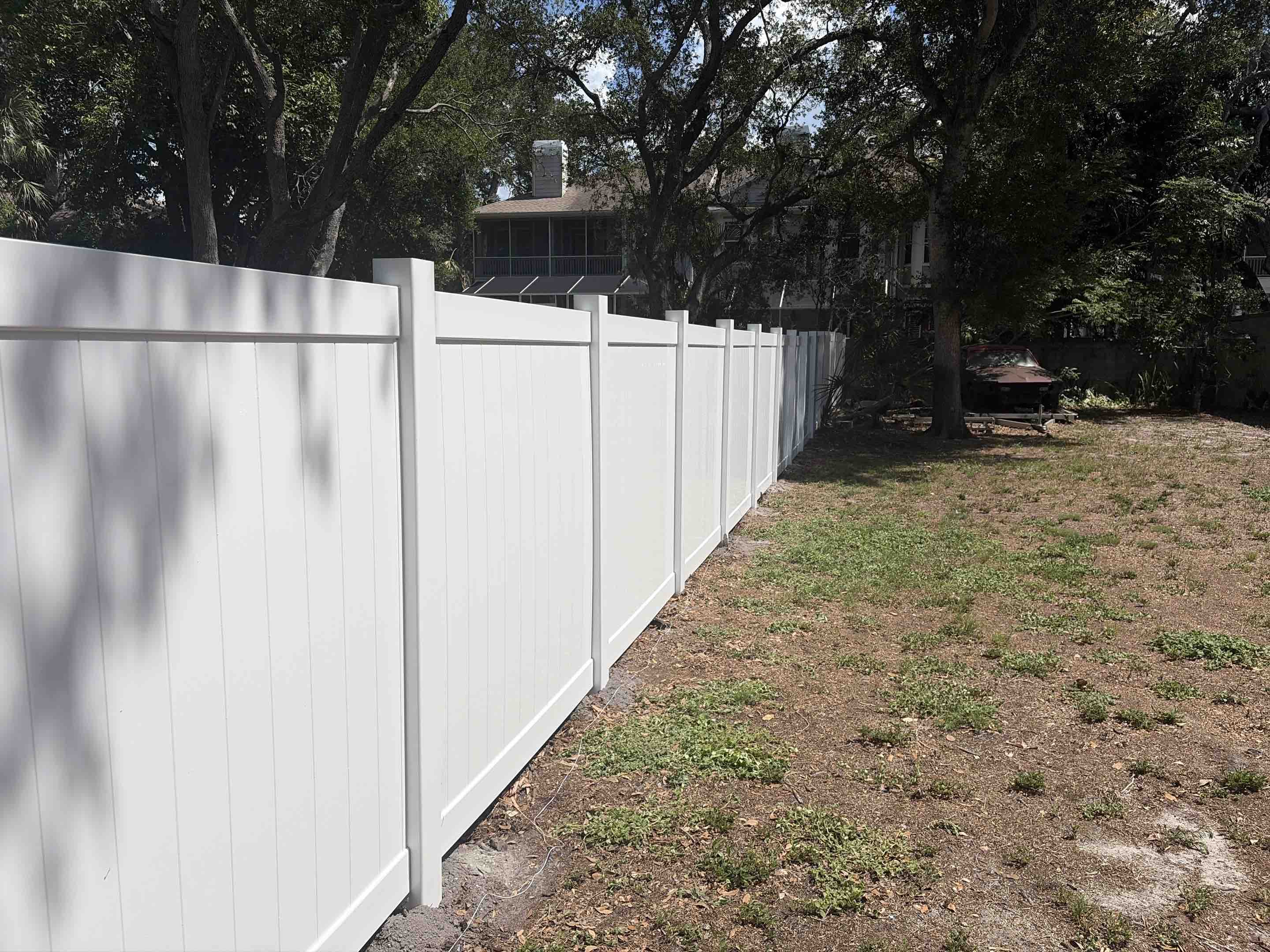 Tampa, FL - Our team recently completed a project installing a white vinyl privacy fence for a residential property. The fence was meticulously designed to provide maximum privacy while enhancing the aesthetic appeal of the property. We began by conducting a thorough site assessment to determine the optimal placement and height of the fence. Following this, we carefully measured and marked the area for precise installation. Each section of the vinyl panels was cut to size and securely fastened to the posts, ensuring a strong and durable structure. The vinyl material was chosen for its low maintenance and resistance to weathering, making it an ideal choice for this project. The final result is a sleek, modern fence that offers the homeowner peace of mind and seclusion.