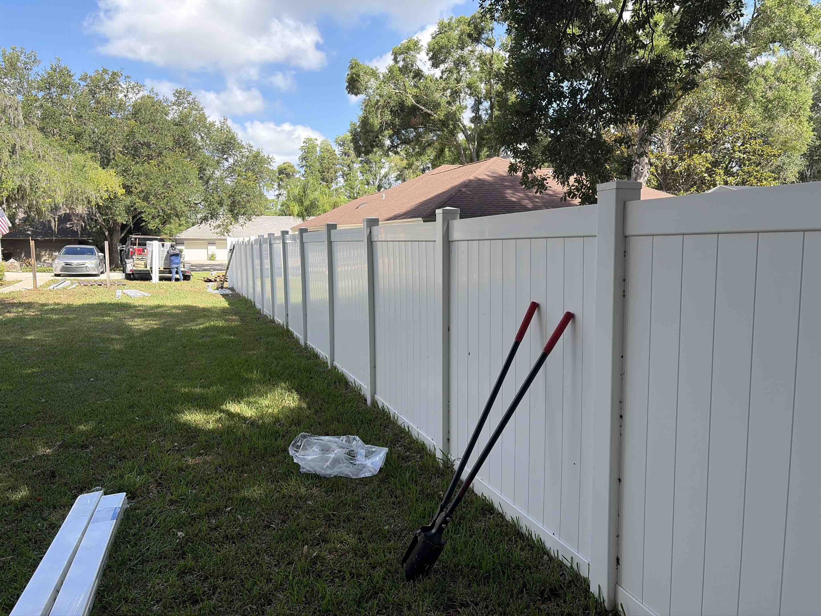 Lutz, FL - Our team successfully completed the installation of a stunning white vinyl fence. We meticulously measured and marked the perimeter, ensuring precise alignment. Each section of the vinyl fencing was carefully cut to fit the designated area. We installed sturdy posts, anchoring them securely into the ground. The vinyl panels were then attached, creating a seamless and elegant barrier. We paid close attention to detail, ensuring all connections were tight and secure. The final result is a durable, low-maintenance fence that enhances the property's aesthetic appeal.
