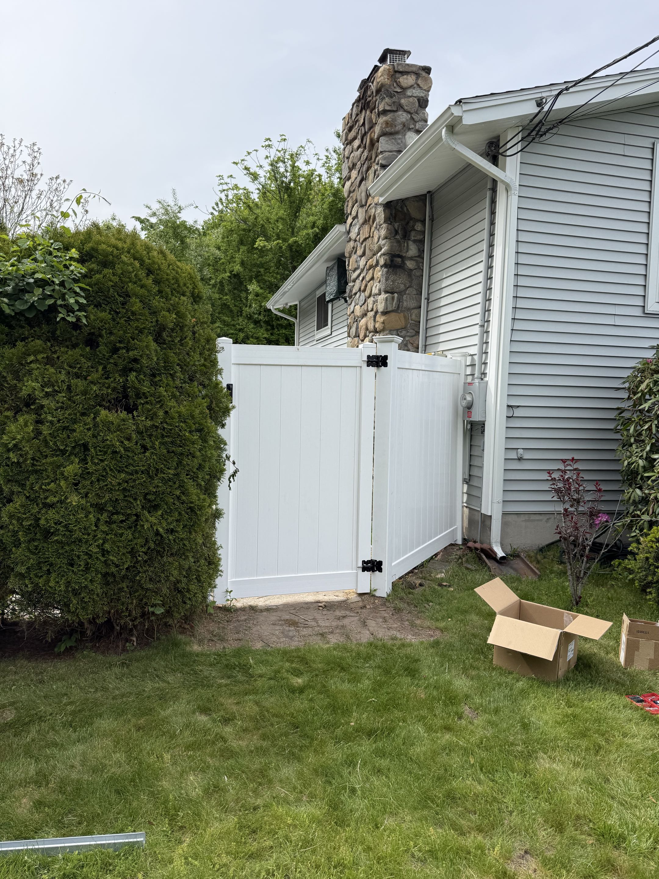 Methuen, MA - Converted an old chain-link fence into this fresh new vinyl gate. 