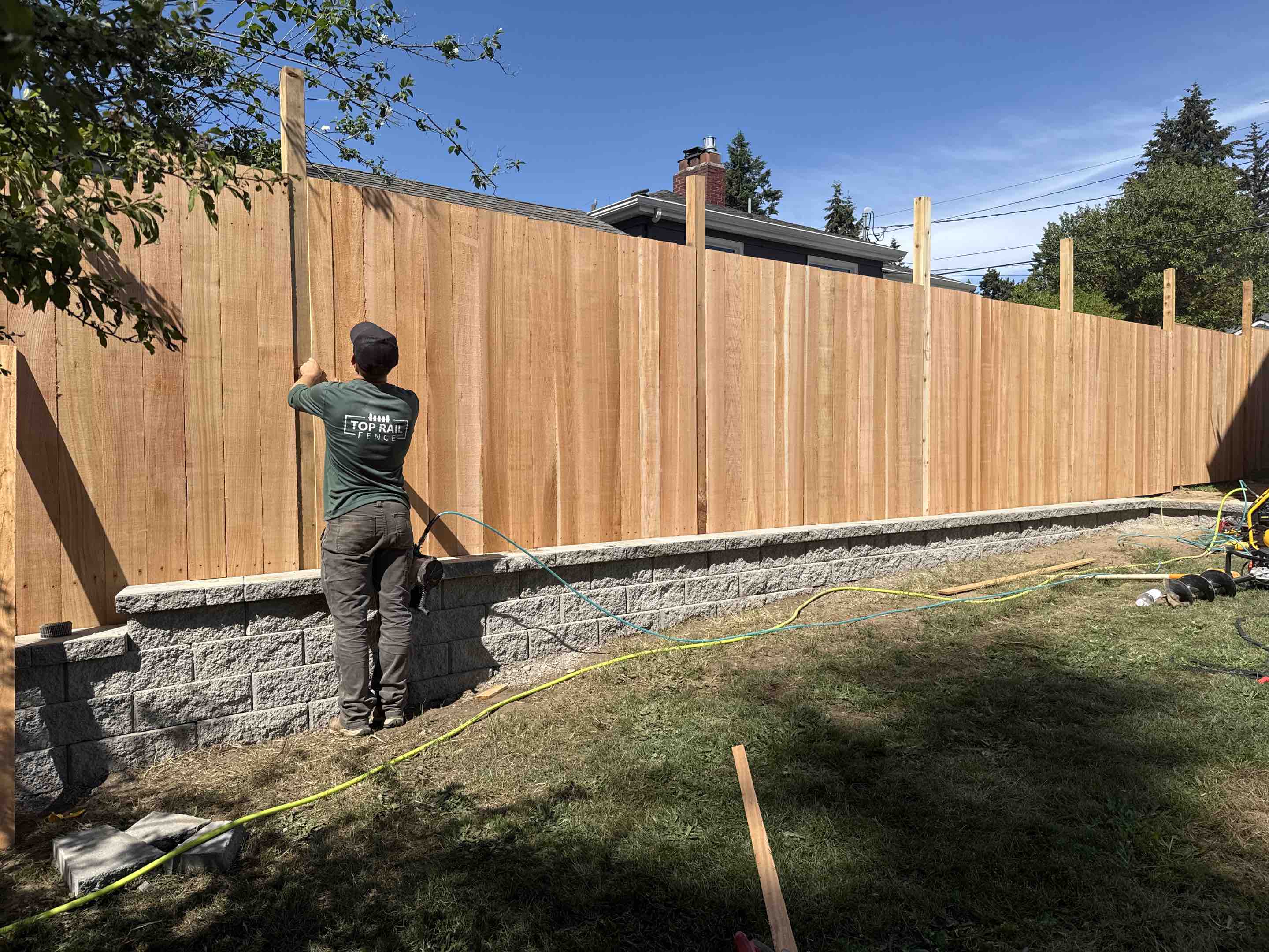 Seattle, WA - First we built the retaining wall, now the fence on top in Northgate.