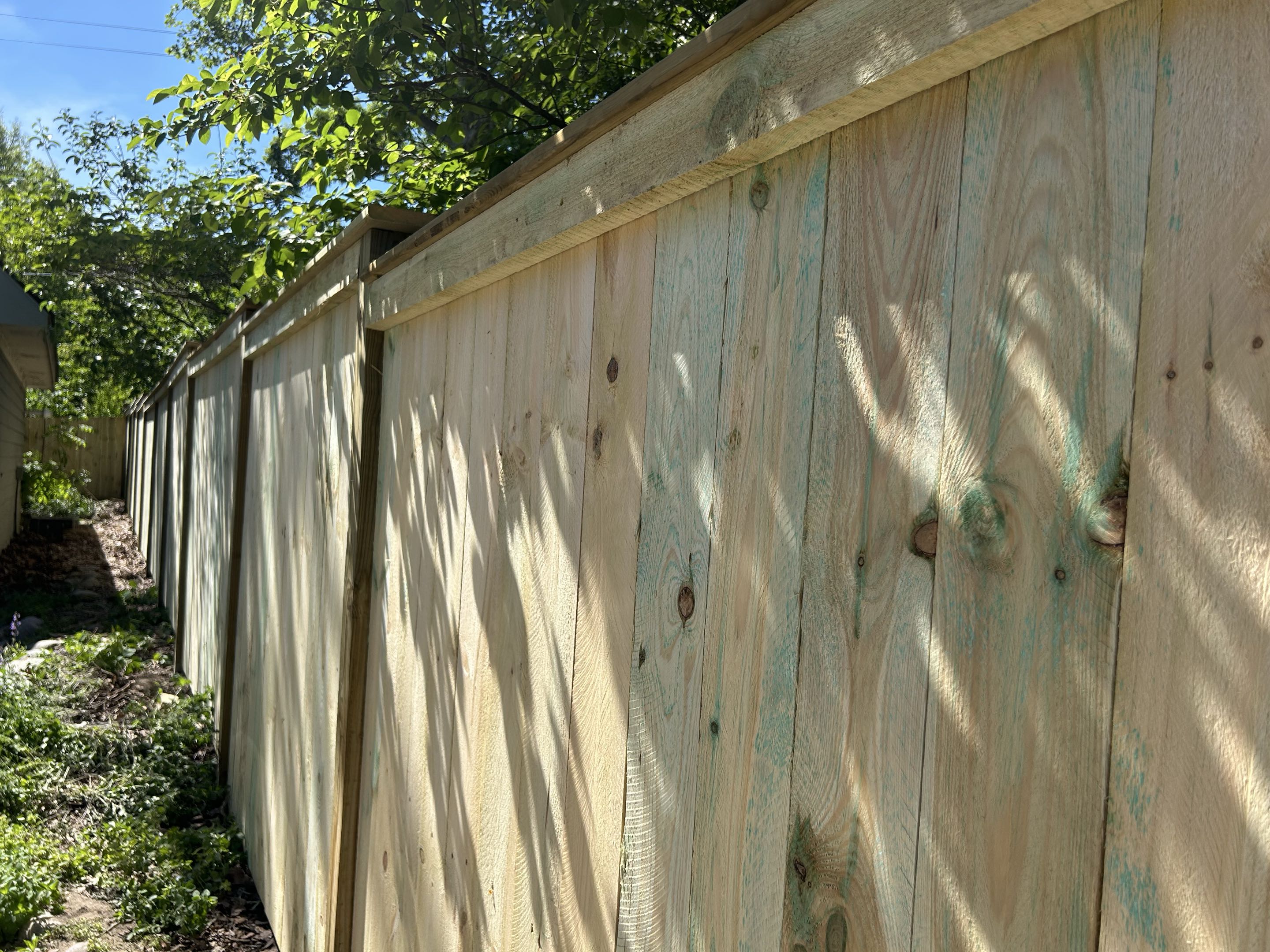 Ann Arbor, MI - Top Rail Fence Ann Arbor is off Mill Road today in Ann Arbor and we just completed this cap and trim wood fence.  It looks great and the customer is thrilled with the design.